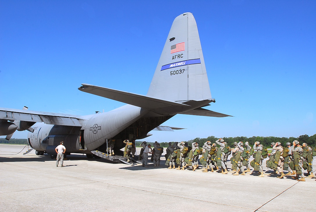 U.S. Army Airborne School students are loaded into a C-130 aircraft for their third parachute jump, and first jump with combat equipment, on Fort Benning, Ga., July 21, 2009.