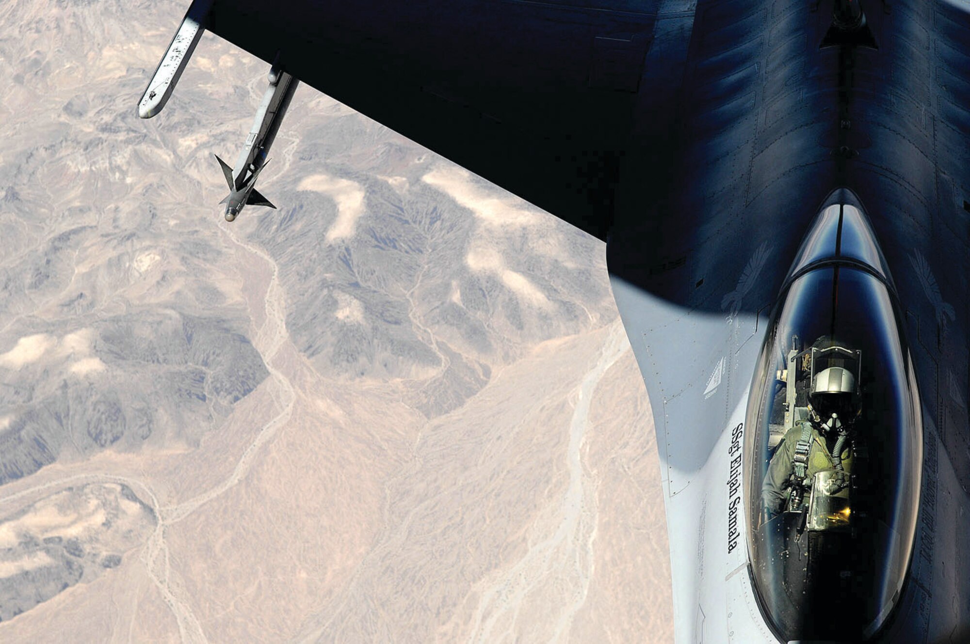 An F-16 Fighting Falcon from the 56th Fighter Wing out of Luke Air Force Base, Arizona, moves into position to receive fuel from a KC-135R Stratotanker from the 336th Air Refueling Squadron during an aerial refueling training mission over the skies of Arizona on Wednesday July 7. The 336th ARS is from the 452nd Air Mobility Wing at March ARB. (U.S. Air Force photo/ Master Sgt. Rick Sforza)