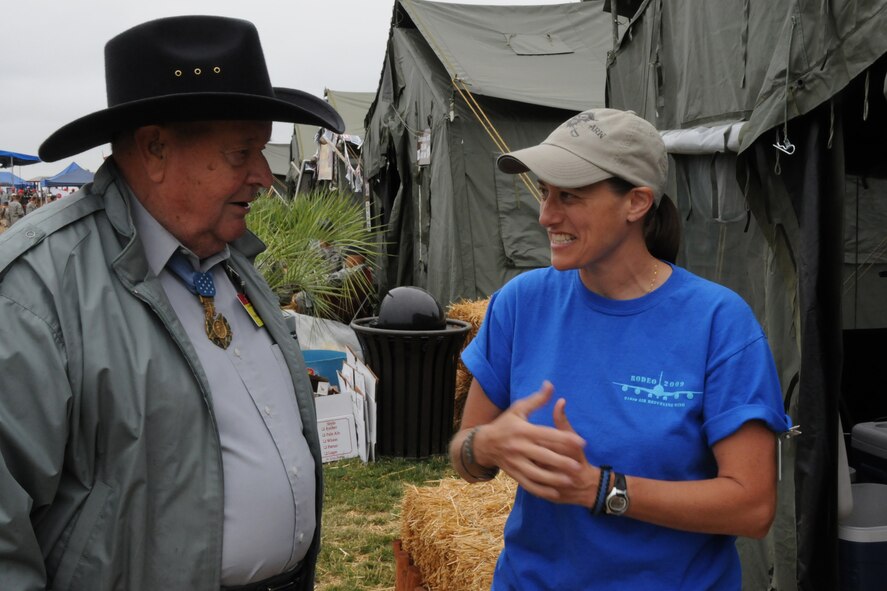 SEYMOUR JOHNSON AIR FORCE BASE, N.C. -- Master Sgt. Wendy Lopedote, 916th Security Forces, talks to Medal of Honor recipient Col. (ret.) Joe Jackson at the 916th hospitality tent at RODEO 2009. Colonel Jackson earned the MOH for heroic actions as a C-123 pilot in Vietnam. Sergeant Lopedote went as an observer. (U.S. Air Force photo/TSgt. Scotty Sweatt, 916ARW/PA)