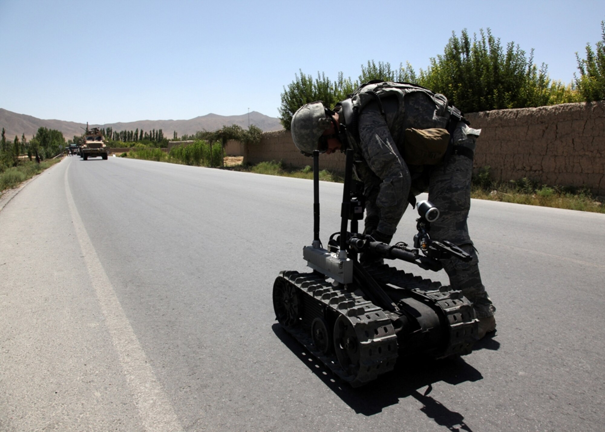LOGAR PROVINCE, Afghanistan - Air Force Staff Sgt. Carl Dill turns on a Talon in Logar province, Afghanistan, July 15. The Talon is a remote controlled robot that searches out possible Improvised Explosive Devices. Sergeant Dill is currently assigned to the 741st Explosive Ordnance Device Battalion, Task Force Spartan, 3rd Brigade Combat Team, 10th Mountain Division. (U.S. Army photo/Pfc. Richard W. Jones Jr.)

