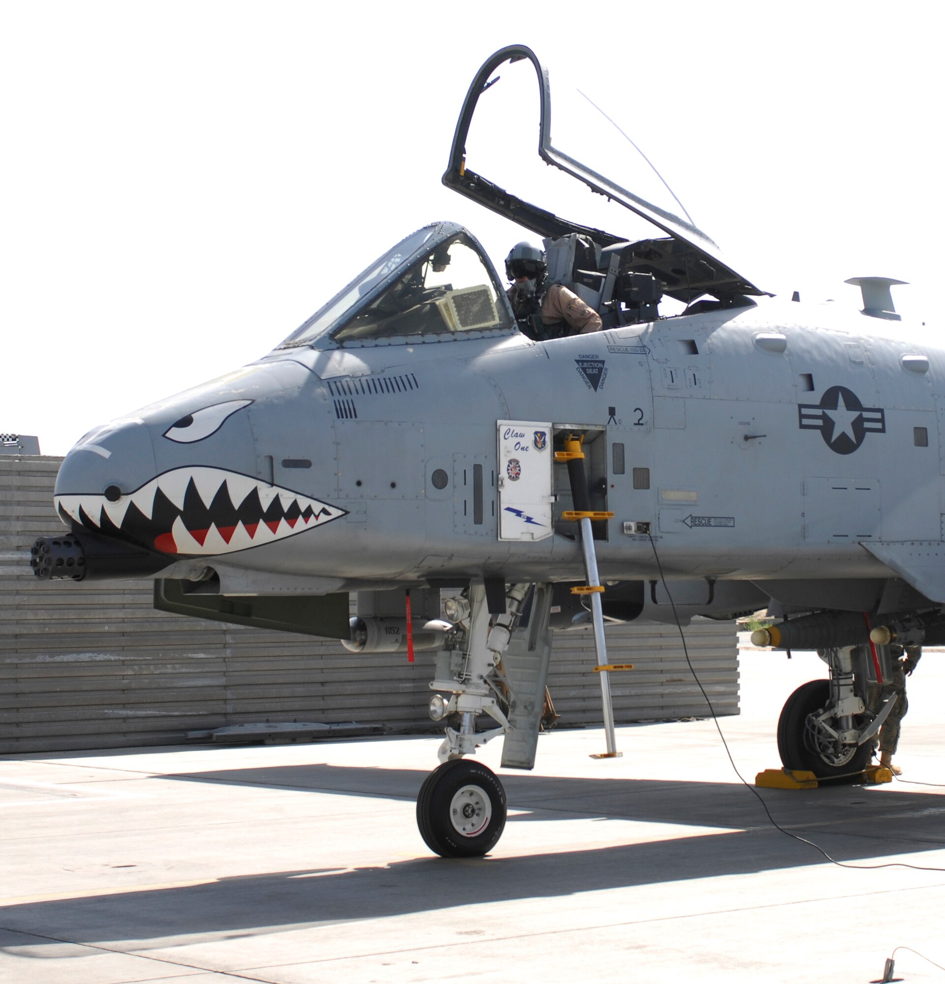 BAGRAM AIRFIELD, Afghanistan - Lt. Col. Philip Weilhouwer, 74th Expeditionary Fighter Squadron commander, readies his Warthog for a mission in the skies of Afghanistan. His A-10 squadron has a lineage prior to WWII and were known as the Flying Tigers and recently they’ve completed over 12,000 combat hours – a feat for any fighting unit. The native of East Windsor, Conn. is currently deployed from Moody Air Force Base, Ga. (U.S. Air Force photo/Tech. Sgt. John Jung)