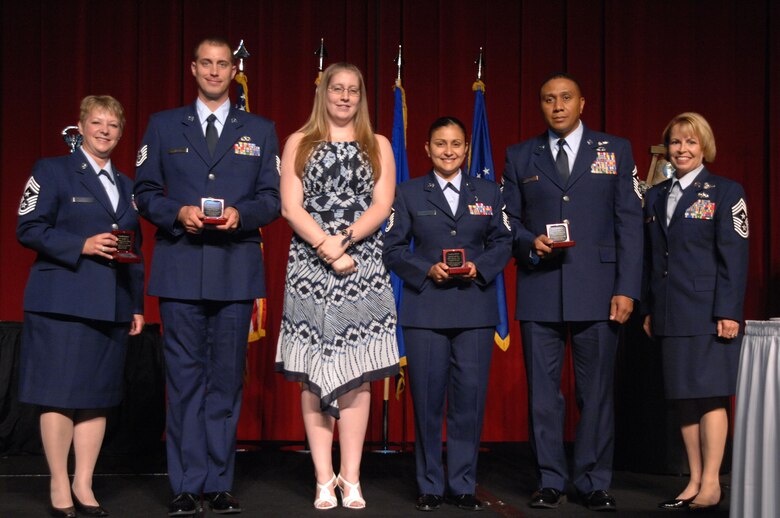 The Fourth Air Force Outstanding Airmen of the Year for 2008 award recipients of the 11th Annual Raincross Trophy Dinner held July 23, 2009, at the Riverside Convention Center, Riverside, Calilf, are as follows: Senior Amn. Channel Bolton-Scholl; Airman of the Year, accepted on her behalf by Chief Master Sgt. Gloria Bennett, Techmical Sgt. Phillip Balson,  Non-commissioned Officer of the Year, and his wife Jessica, Master Sgt. Cynthia Villa, Senior Non-commissioned Officer of the Year, and Senior Master Sgt. James Felton, Jr., First Sergeant of the Year. Chief Master Sgt. Patricia Thornton, Fourth Air Force Command Chief, far left, was the presenter at the dinner hosted by the Greater Riverside Chambers of Commerce Military Affairs Committee to honor and recognize the 11 wings and two groups in 4th Air Force.  (U. S. Air Force photo/Senior Master Sgt. Kim Allain)  (released)