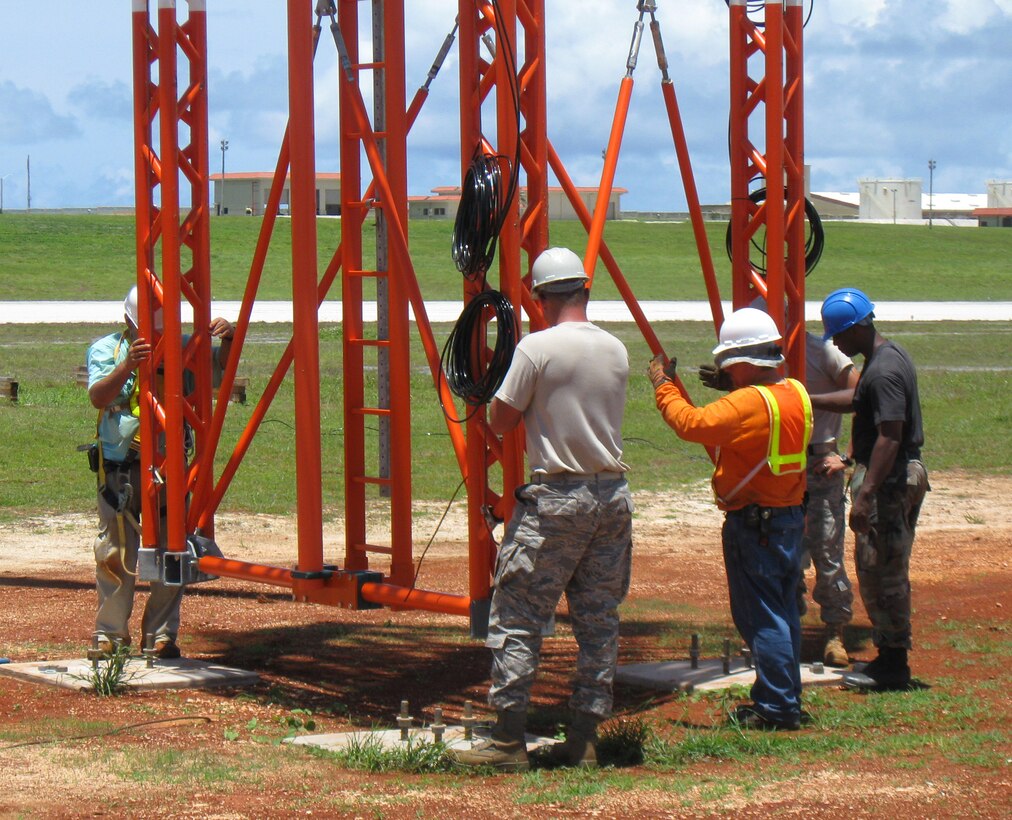 ANDERSEN AIR FORCE BASE, Guam - Members of the 36th Communications Squadron work with civilian contractors to install an instrument landing system on the flightline here. The system is one of four new Selex 2100 Series instrument landing systems to be added to the flightline. These systems enable aircraft to safely land on the runway in austere flying conditions. (Courtesy photo)