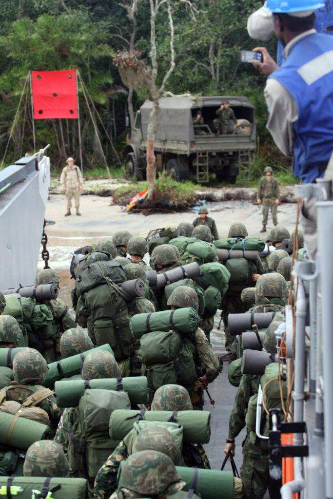 Landing Craft Unit 1643 unloads Marines on the island of Marambaia off the coast of Brazil for the start of the final portion of Southern Exchange 2009 (SE09). The Final Exercise, which spanned two days, covered all aspects used during peacekeeping and humanitarian/disaster relief missions. (Marine Corps photo by Lance Cpl. Jonathan G. Wright/Released)