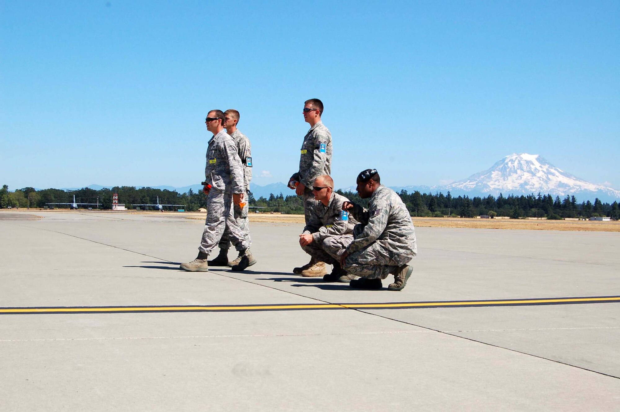 KC-135 mainainers from the 319th Air Refueling Wing's RODEO team anxiously wait as umpires inspect their jet during the Air Mobility RODEO at McChord AFB, Wash. Umpires have one hour to complete inspections while team members stand by for results. (U.S. Air Force photo/Tech. Sgt. Amanda Callahan)