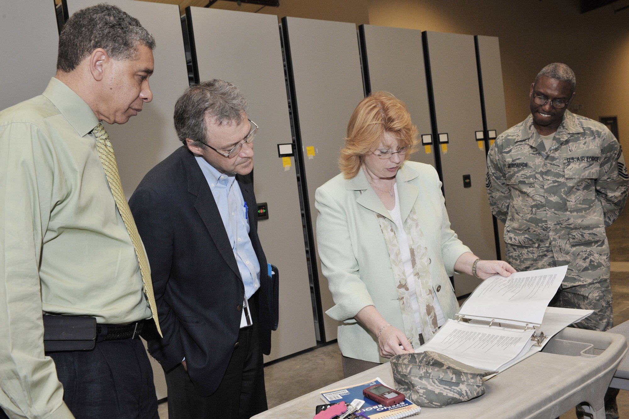 Jerry Phillips (left to right) , Rich Noble, Penny Sayle and Senior Master Sgt. Darin Murdaugh visit a recently renovated war record storage facility July 1 at Shaw Air Force Base, S. C. Mr. Phillips is the Air Combat Command command records manager. Mr. Noble is the archives specialist for the National Archive and Records Administration. Ms. Sayle is an Air Force records officer. Sergeant Murdaugh is the U.S. Air Forces Central Command 3A functional manager. (U.S. Air Force photo/Tech. Sgt. Josef Cole)