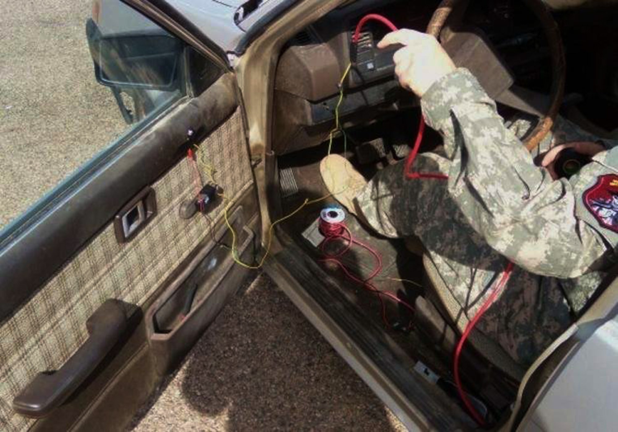 A Navy Weapons Intelligence Team member in training transforms a vehicle into a training vehicle borne improvised explosive device during a course March 13 at Fort Huachuca, Ariz. Potential WIT members received training in IED construction, fingerprinting, biometrics, foreign weapons, media exploitation and sensitive sight exploitation. (U.S. Air Force photo/Staff Sgt. Joshua Strang) 