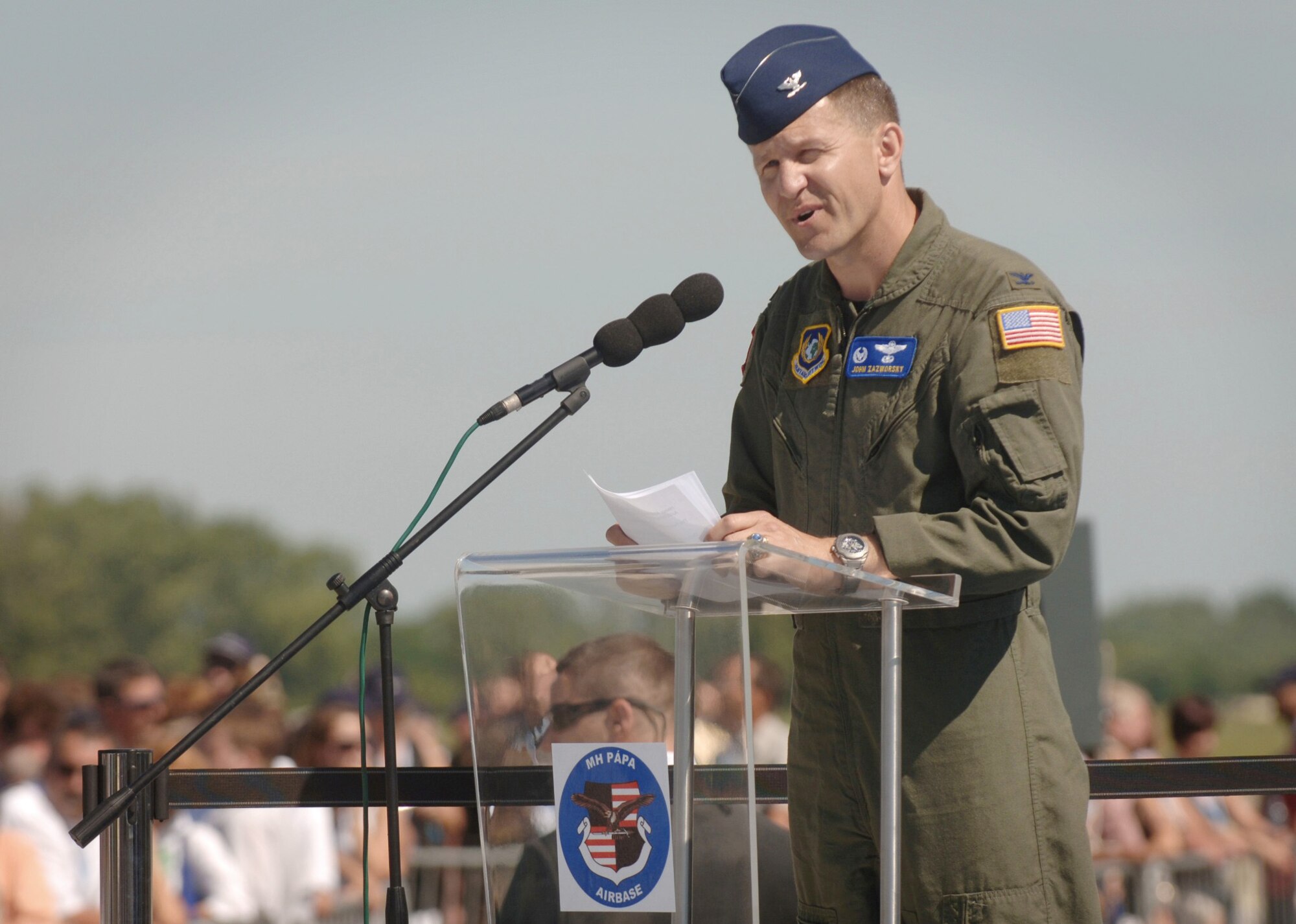 During the official activation ceremony of a first-of-its-kind multinational heavy airlift wing at Papa Air Base, Hungary, on July 27, U.S. Air Force Col. John Zazworsky gives thanks to the 12-nation team who, during the last 10 months, stood up the organization that will provide strategic airlift worldwide for humanitarian, disaster relief, and peacekeeping missions in support of the European Union, United Nations and NATO. (U.S. Air Force photo/Master Sgt. Scott Wagers)