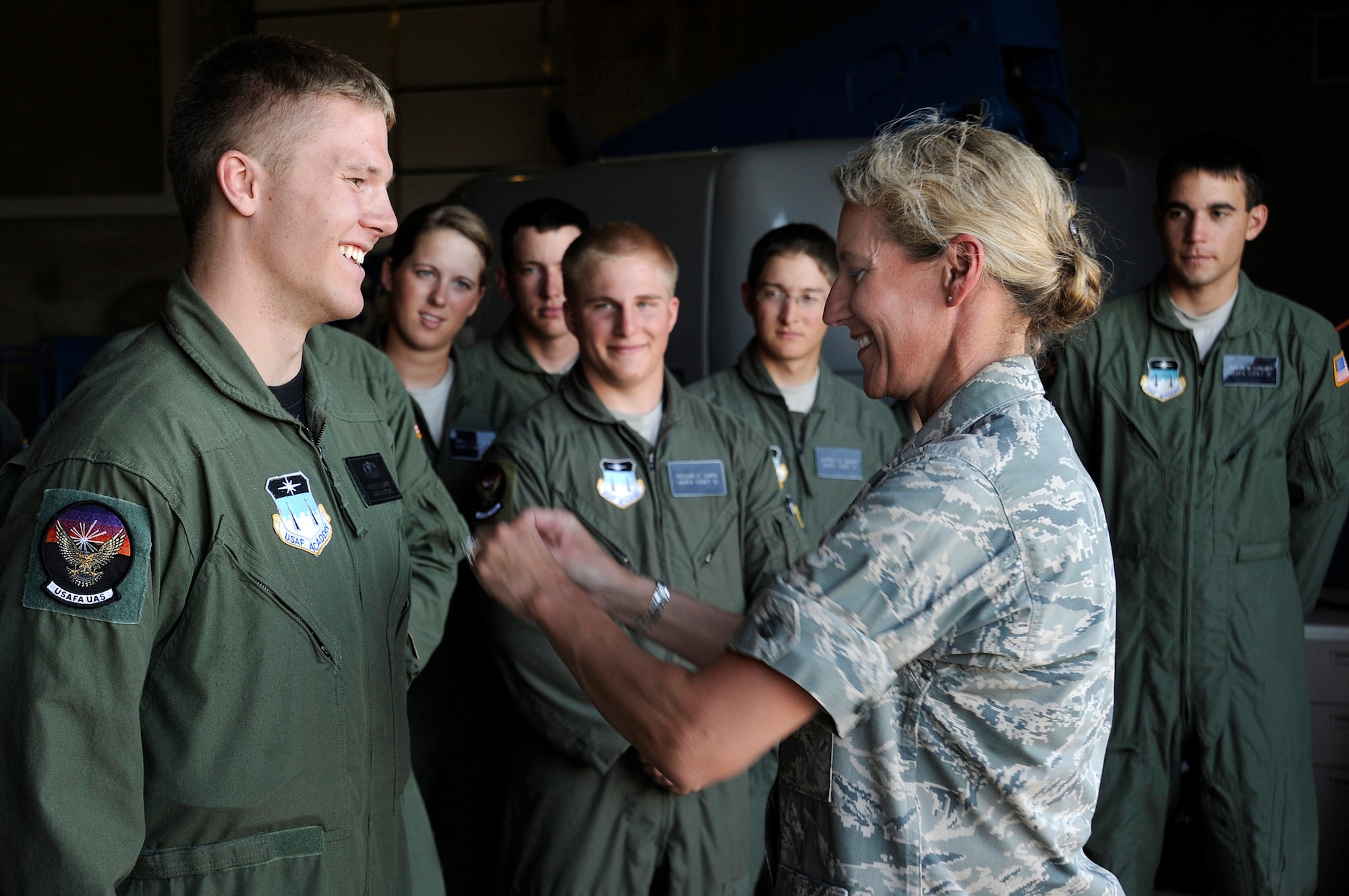 Brig. Gen. Dana H. Born awards Basic Airmanship Wings to Cadet 2nd Class Bradley Sapper July 23 at the U.S. Air Force Academy, Colo. General Born is the Academy dean of faculty. (U.S. Air Force photo/Mike Kaplan)