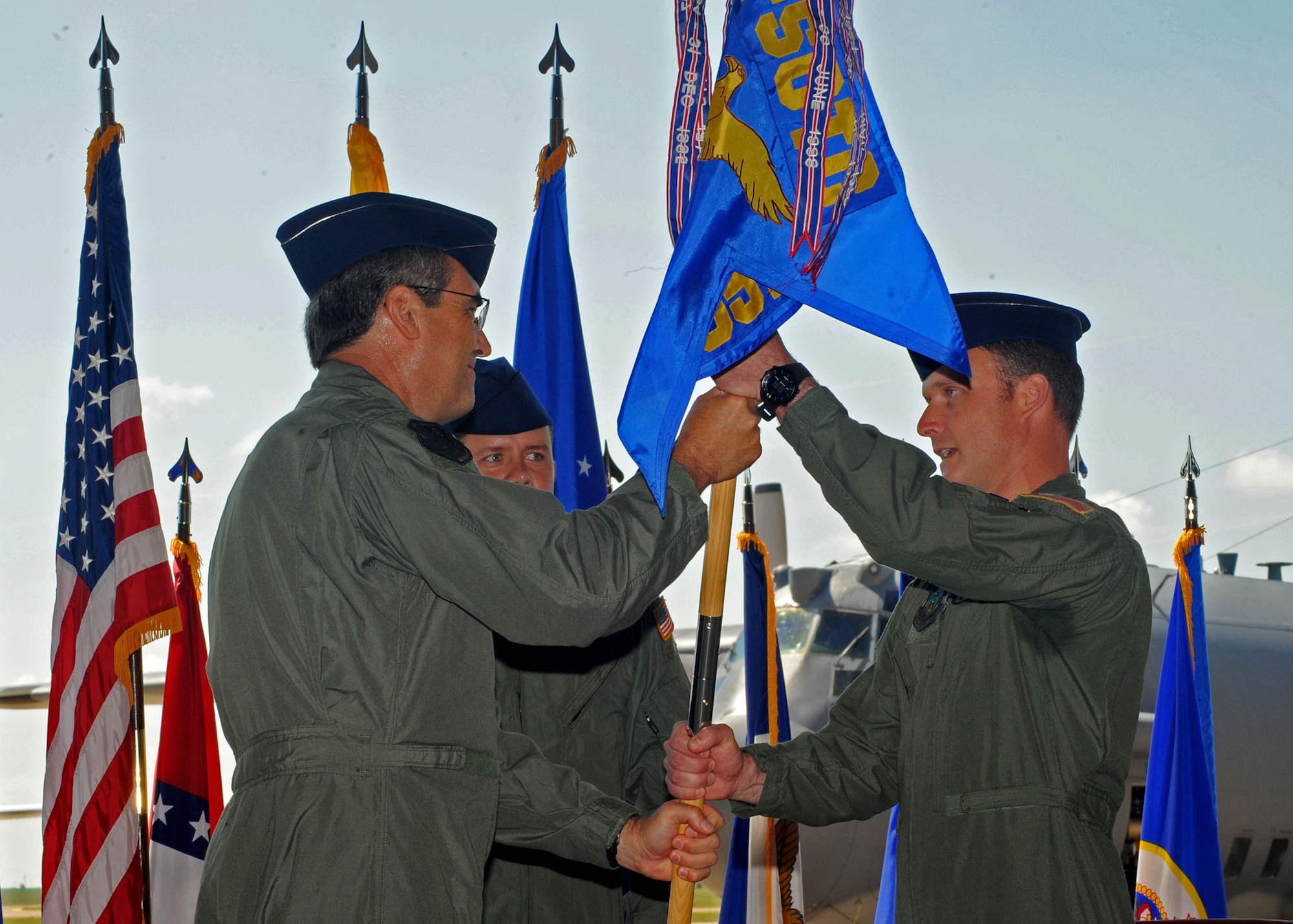 CANNON AIR FORCE BASE, N.M. -- Paul Harmon (left), Air Force Special Operations Training Center commander, presents Lt. Col. Arthur Davis (right) with the 551st Special Operations Squadron guidon during the activation of the squadron as Colonel Arthur Davis assumed command July 24. The squadron reactivated immediately after Air Force Special Operations Training Center, Detachment 1 inactivated, but will continue to train aircrews on multiple weapons systems on a variety of aircraft.  (U.S. Air Force Photo by Staff Sgt. Heather R. Redman)