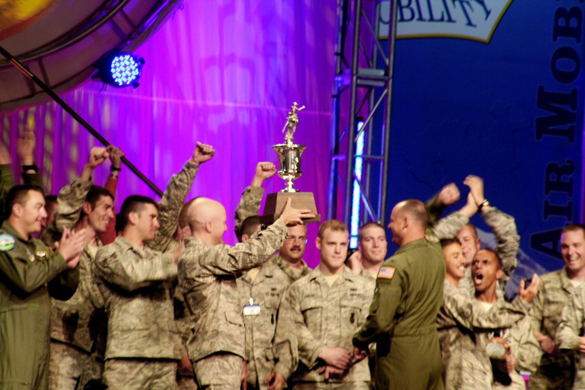 Members of the 62nd Airlift Wing from McChord Air Force Base, Wash., hold up the trophy for winning Best Air Mobility Team for Air Mobility Rodeo 2009 July 24 at McChord AFB. The award is considered the "Best of the Best" in the Rodeo competition. (U.S. Air Force photo/Tech. Sgt. Scott T. Sturkol) 
