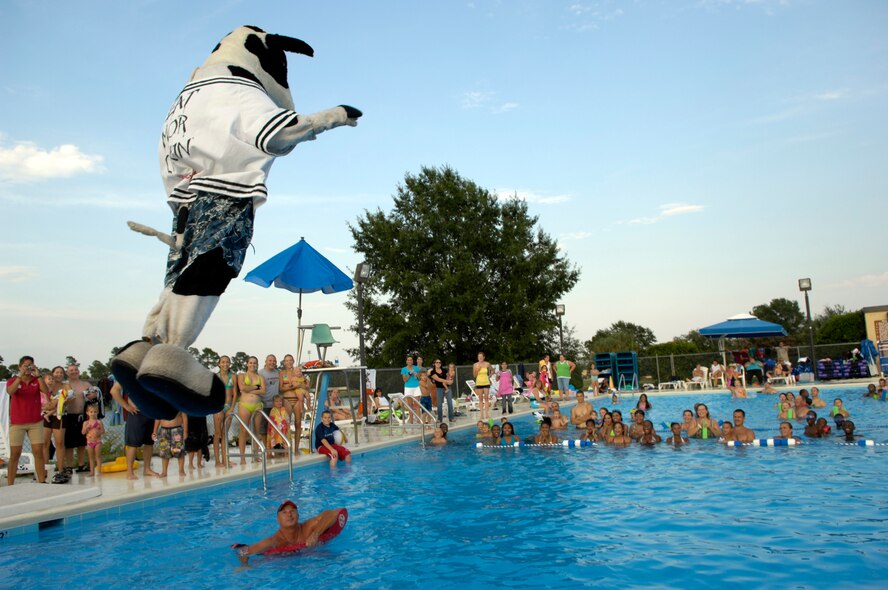 SHAW AIR FORCE BASE, S.C. -- Cow, the Chick-Fil-A mascot, jumps off the diving board at Lakeside pool, July 23. Sumter Chick-fil-A marketing sponsored a pool party and provided free food for Airmen and their families. (U.S. Air Force photo/Senior Airman Kathrine McDowell)
