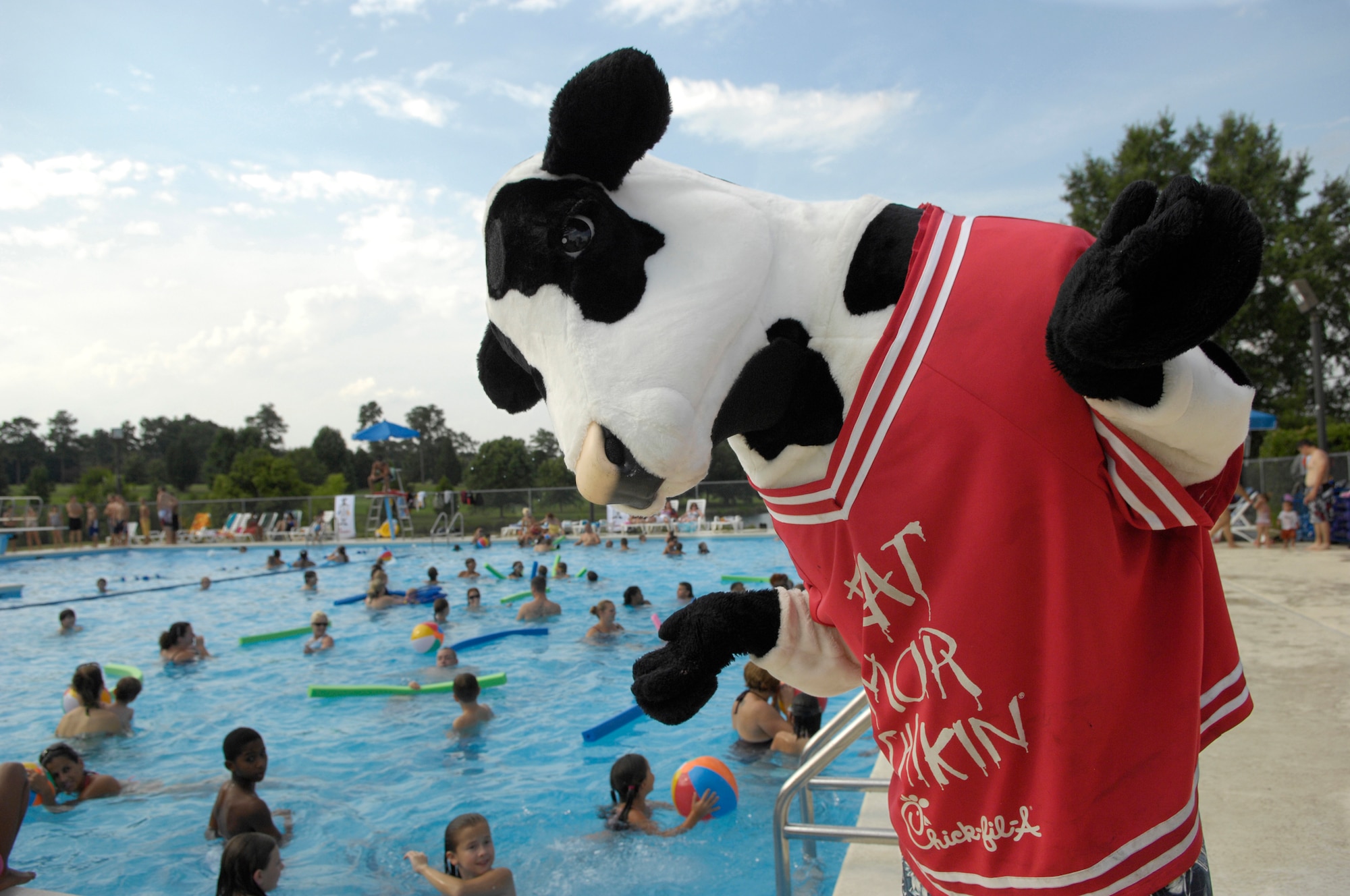 SHAW AIR FORCE BASE, S.C. -- Cow, the Chick-Fil-A mascot, makes an appearance at the Lakeside pool here, July 23. The Sumter Chick-fil-A marketing team sponsored a pool party and free food for Shaw Airmen and their families. (U.S. Air Force photo/Senior Airman Kathrine McDowell)
