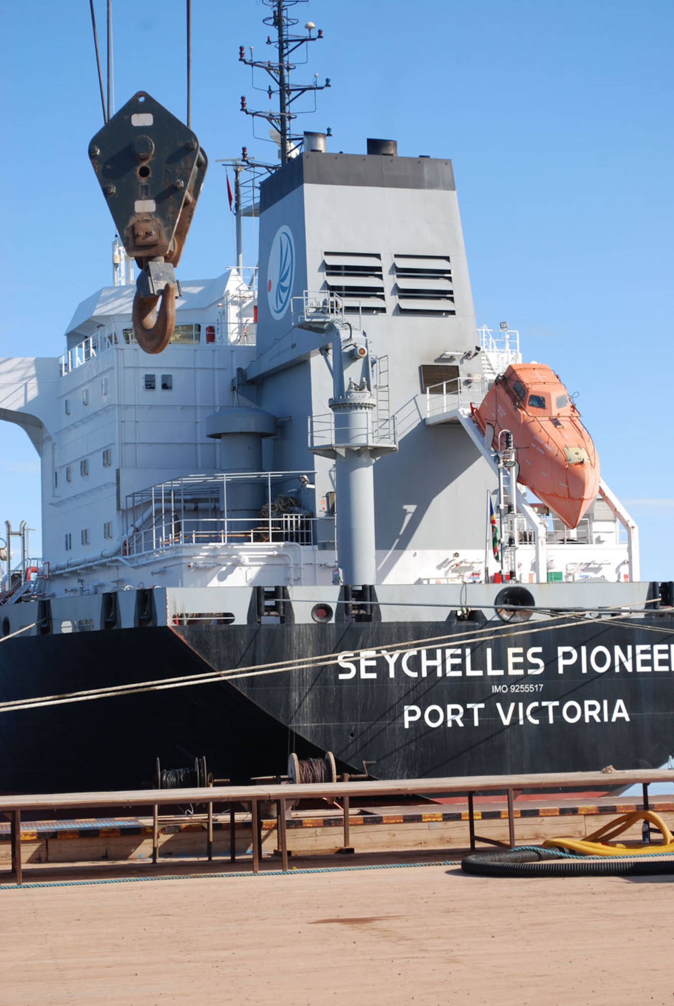 Merchant ship Seychelles Pioneer sits off Thule's pier July 19, and its multinational crew waits to offload fuel as part of Thule's annual resupply activities named Operation Pacer Goose. The oil tanker delivered about 10 million gallons of diesel fuel that will last until next summer. From the beginning of July through August, ships from all over the world will deliver critical cargoes to sustain operations at Thule and other military and scientific installations in the area, including Canadian military posts Stations Alert and Eureka, Danish meteorlogical outpost Station Nord and National Science Foundation research outposts Summit and NEEM stations (Photo by 1st Lt. Lisa Meiman).