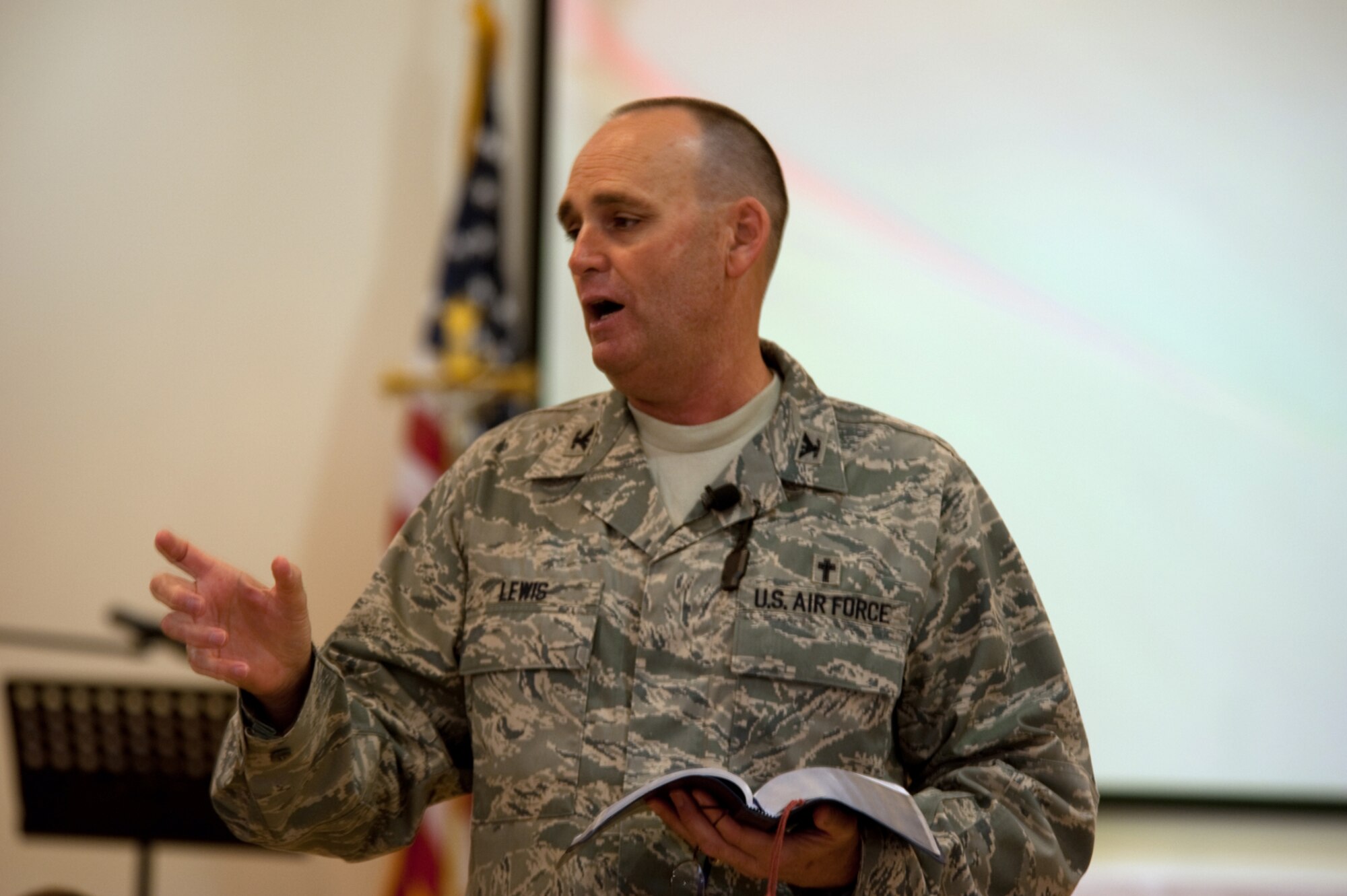 Chaplain (Col.) Jerry D. Lewis, Air Forces Central Command command chaplain, delivers a sermon to military personnel at the 379th Air Expeditionary Wing Victory Chapel, July 19, in Southwest Asia. The Victory Chapel is open 24/7, ensuring servicemembers have the freedom to exercise their religious beliefs while deployed in support of Operations Iraqi and Enduring Freedom. (U.S. Air Force Photo/Staff Sgt. Robert Barney)