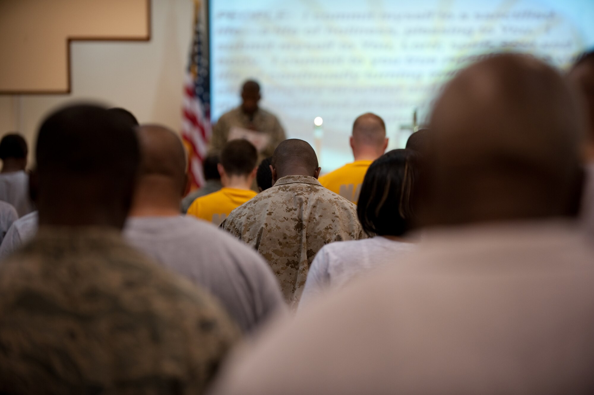 Military personnel participate in services at the 379th Air Expeditionary Wing Victory Chapel, July 19, in Southwest Asia. The Victory Chapel is open 24/7, ensuring servicemembers have the freedom to exercise their religious beliefs while deployed in support of Operations Iraqi and Enduring Freedom. (U.S. Air Force Photo/Staff Sgt. Robert Barney)