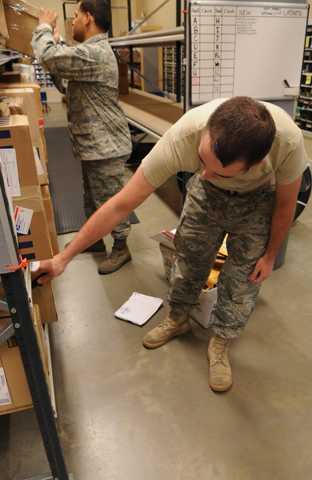 RAF MILDENHALL, England – Senior Airman Tyler Wasson, RAF Mildenhall post office, swabs random boxes for dangerous substances.  A certain percentage of boxes is swabbed every day and analyzed by a computer to screen for harmful material.  (U.S. Air Force photo by Staff Sgt. Austin M. May)