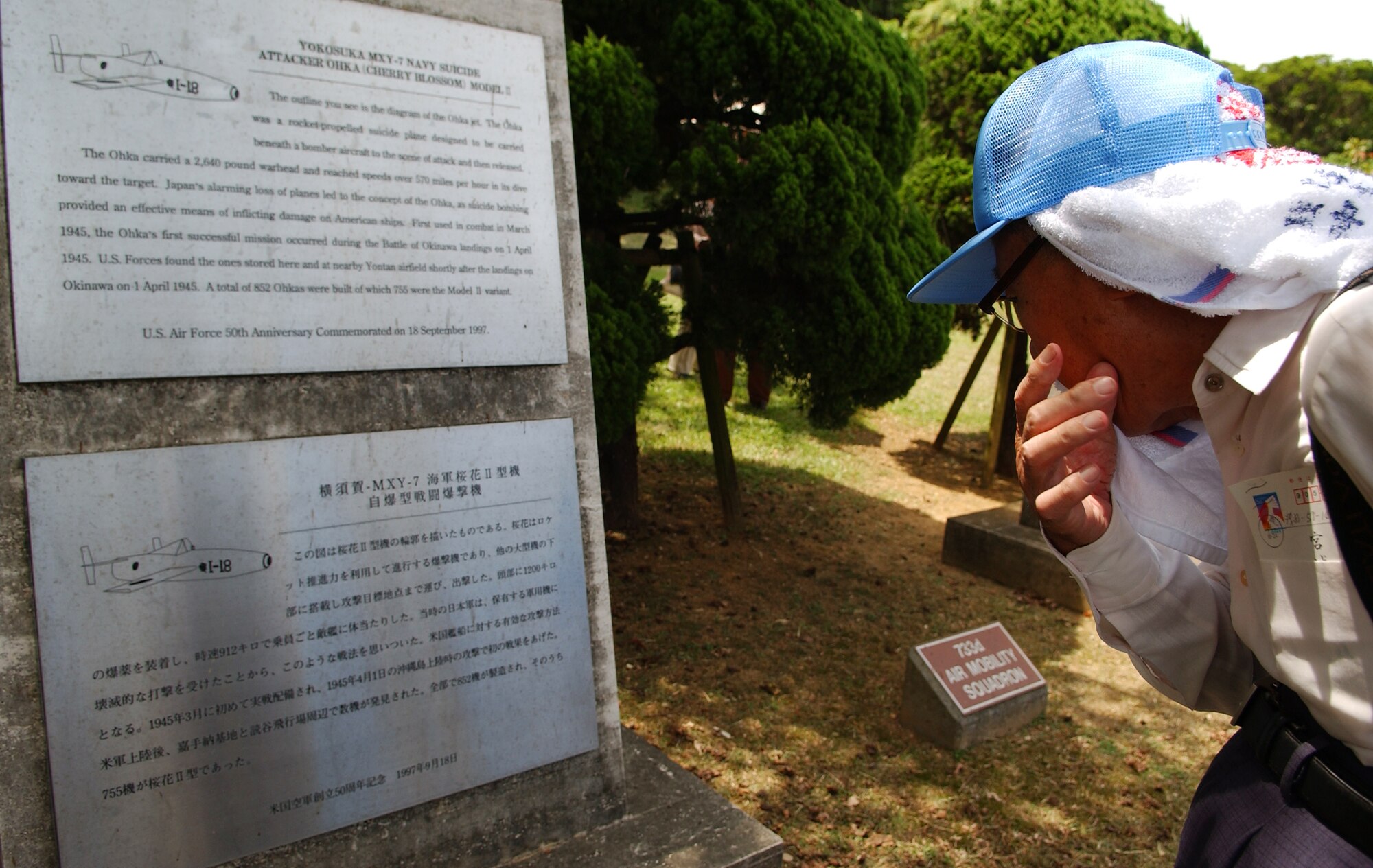 An Okinawan gazes at a monument during his visit to the war-related sites on Kadena Air Base, Japan July 23. Nearly 90 visitors ages 60-90 years old from the Okinawa Prefectural Disabled Veterans Association visited the Peace Garden near the Youth Center and an old aircraft hanger near Gate 3. This group is very unique as they  served in the Imperial Japanese Army during the Battle of Okinawa, sustained  injuries in the war, and have been receiving military pensions from the Government of Japan. They were not directly deployed to Okinawa during the war, but drafted from here to serve in the Army.
(U.S. Air Force photo/Tech. Sgt. Rey Ramon)                      