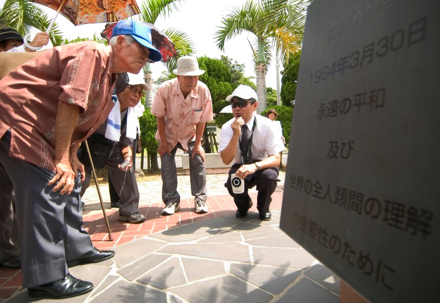 Nearly 80 visitors ages 60-90 years old from the Okinawa Prefectural Disabled Veterans Association visit war-related sites at Kadena Air Base, Japan July 23. The veterans visited the base Peace Garden and an old aircraft hangar. The visitors served in the Imperial Japanese Army during the Battle of Okinawa, (U.S. Air Force Photo/Tech. Sgt. Rey Ramon)