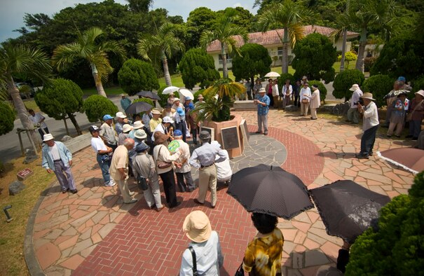 Nearly 90 visitors ages 60-90 years old from the Okinawa Prefectural Disabled Veterans Association visit war-related sites on Kadena Air Base, Japan, July 23. The veterans visited the Peace Garden and an old aircraft hanger. The group is unique as they served in the Imperial Japanese Army during the Battle of Okinawa, sustained injuries in the war, and have been receiving military pensions from the Government of Japan. They were not directly deployed to Okinawa during the war, but drafted from here to serve in the Army. (U.S. Air Force photo/Tech. Sgt. Rey Ramon) 