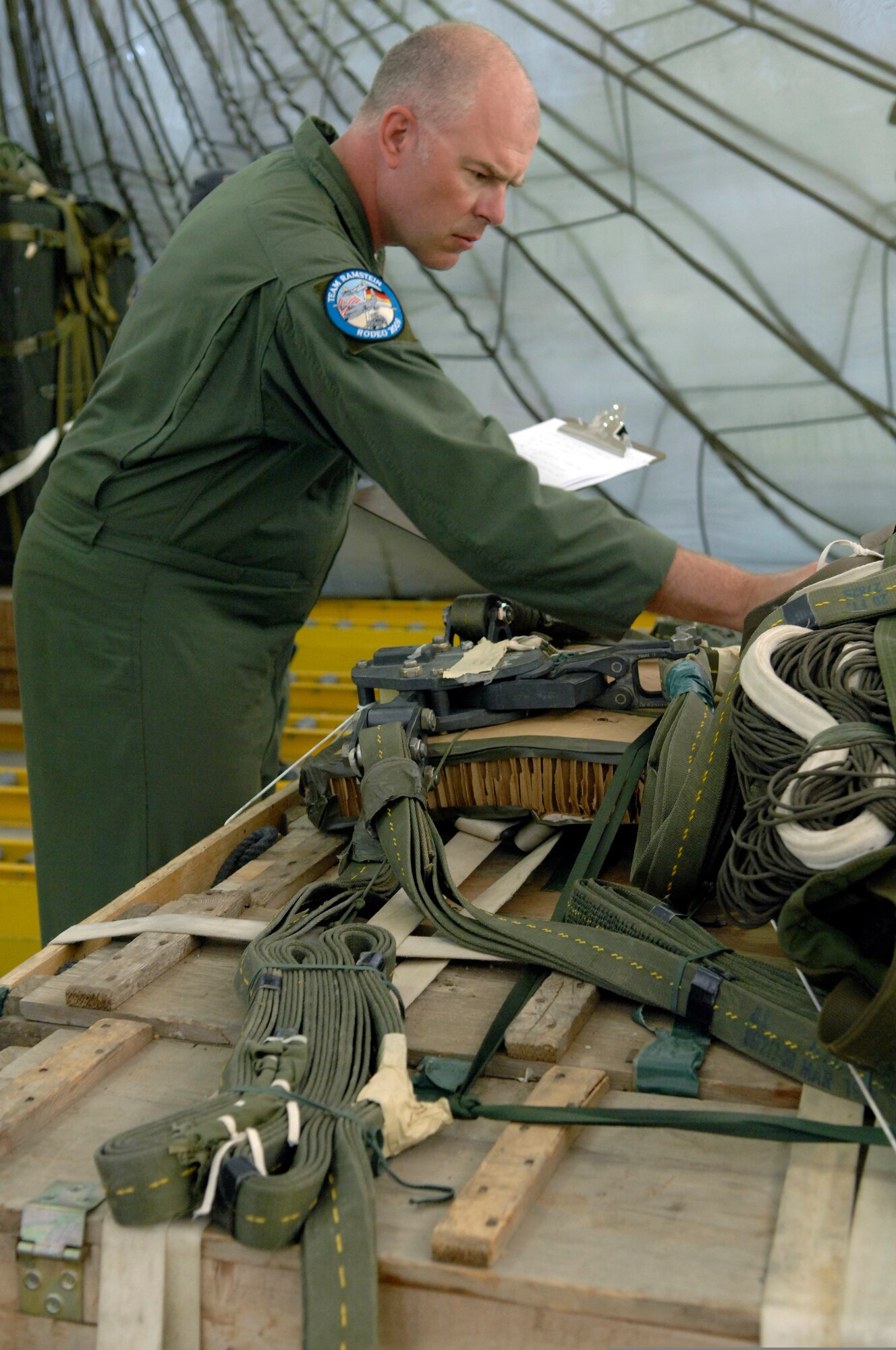 Master Sgt. Ray Hensley, with the 86th Operations Support Squadron, performs a 
joint air drop inspection during Air Mobility Rodeo 2009 at McChord Air Force 
Base, Wash., July 20. More than 50 Airmen from Team Ramstein are part of the 
2,500 servicemembers from around the Air Force and the globe participating in 
the rodeo. The competition, which runs through July 24, is a week-long 
mobility readiness exercises that brings teams together to compete in more 
than 50 judged events spanning the categories of aerial port, aeromedical 
evacuation, aircrew, fit to fight, maintenance and security forces.  (U.S. Air 
Force photo by Senior Airman Matthew Smith)
