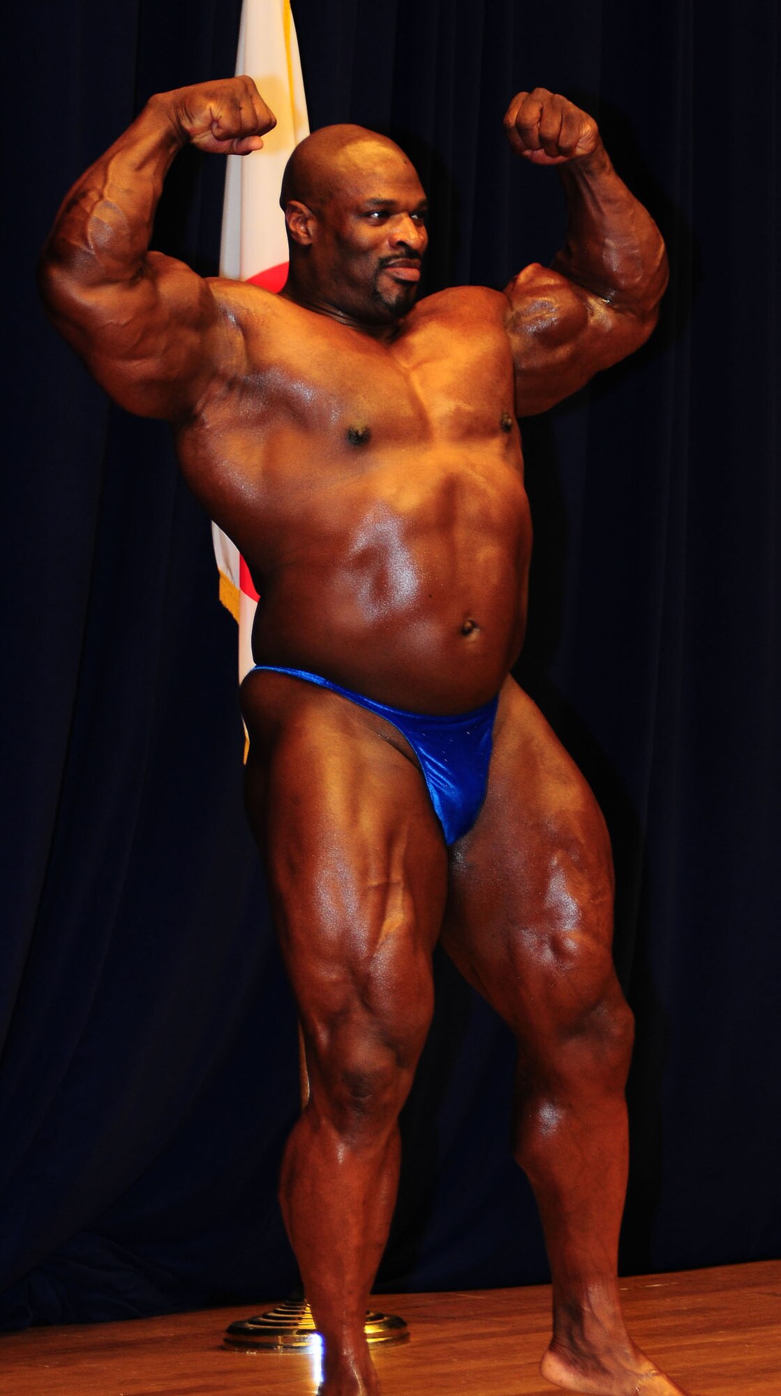 YOKOTA AIR BASE, Japan -- Eight-time Mr. Olympia Ronnie Coleman poses for a crowd of nearly 1,000 spectators July 26 during the 11th Annual Central Japan Bodybuilding and Figure Championship at the Taiyo Community Center.  Seventy-nine competitors, civilian and military, from around Japan took part. (U.S. Air Force photo/Airman 1st Class Devin Doskey)
