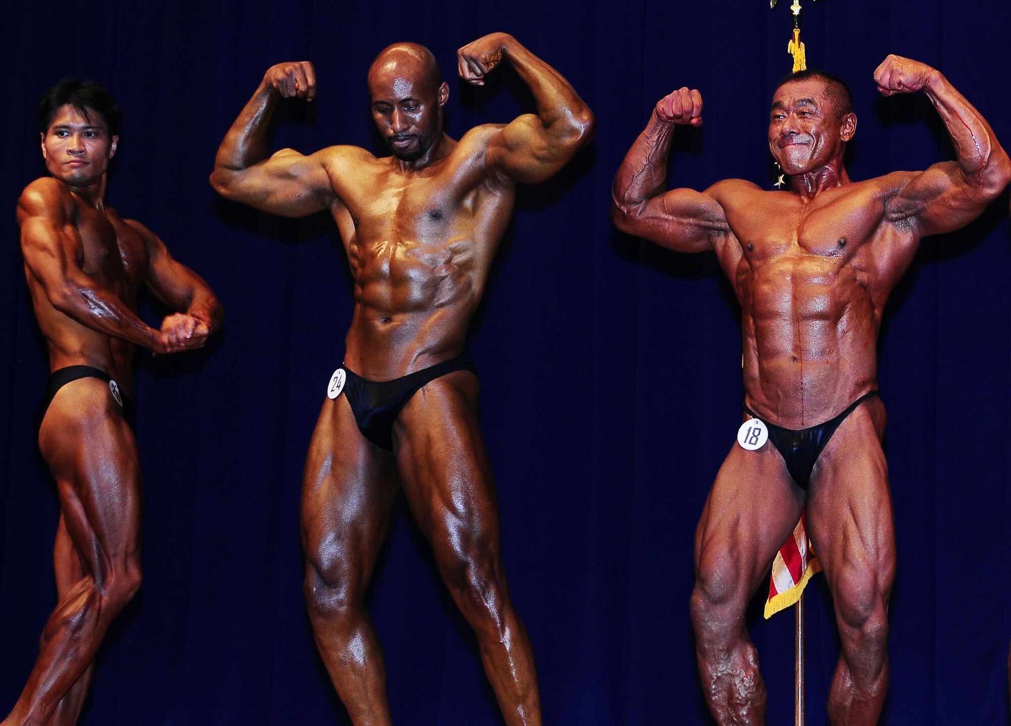 YOKOTA AIR BASE, Japan -- Competitors in the Men's Masters Division of the 11th Annual Central Japan Bodybuilding and Figure Championship pose off July 26 at the Taiyo Community Center. (Left to right) Masayuki Nomura took 5th place, while Dexter Robeson came in second and Yasunobu Komori won top honors in the division. Nearly 1,000 spectators watched 79 competitors, civilian and military, from around Japan show off their physiques. (U.S. Air Force photo/Airman 1st Class Devin Doskey)