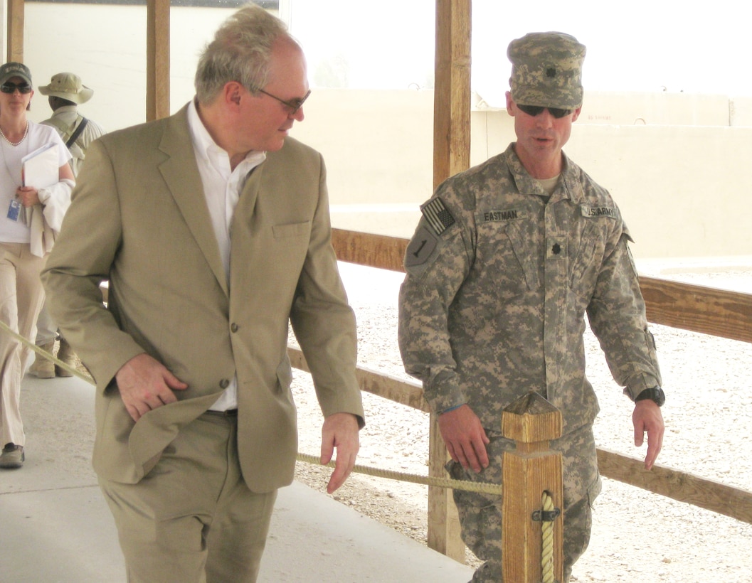 Christopher R. Hill, U.S. ambassador to Iraq, discusses the role of Task Force Pathfinder's support to provincial reconstruction teams with Army Lt. Col. Michael Eastman, task force commander and deputy commander for civil capacity, 1st Armored Division’s 4th Brigade, during a recent visit to Contingency Operating Base Adder near Nasiriyah, Iraq. U.S. Army photo by Maj. Myles Caggins