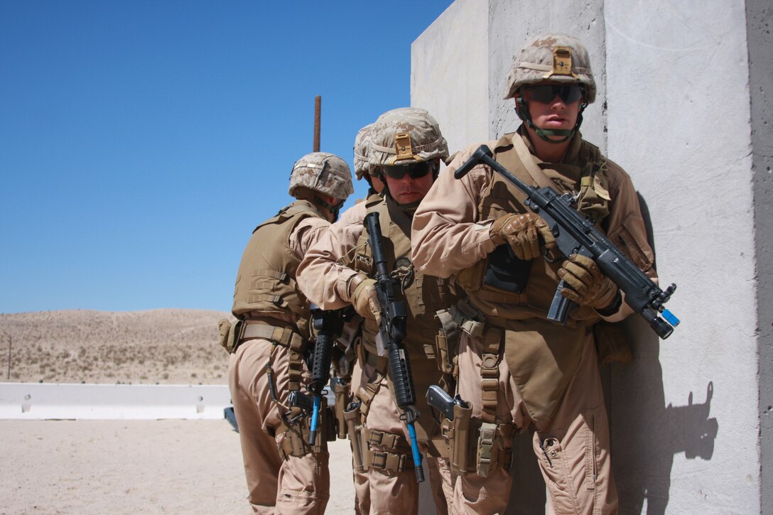 The Combat Center's Provost Marshal's Office's Special Reaction Team prepares to assault another structure at Combat Center Range 111 July 29. The team trainend in one of their speicialties, urban warfare in preparation for future operations.