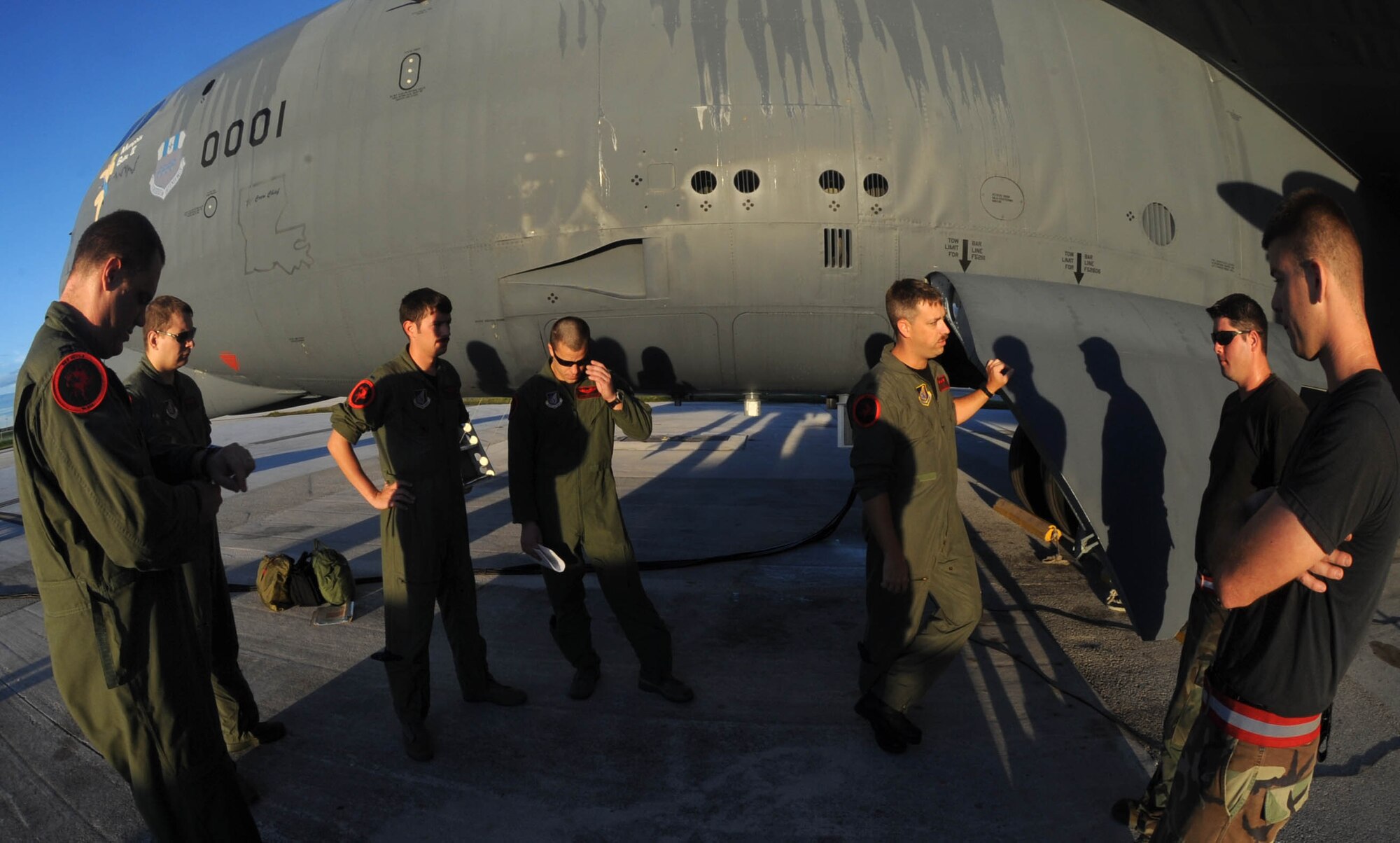 A B-52 Stratofortress flight crew inspects the aircraft prior to starting engines for a Talisman Saber 2009 mission July 24. The 96th Expeditionary Bomb Squadron, deployed to Andersen Air Force Base, Guam, completed 10 sorties flying more than 110 hours while participating in the joint and coalition exercise July 15-24.  The B-52s are deployed from Barksdale AFB, La., to support U.S. Pacific Command’s Continuous Bomber Presence in the Asia-Pacific region.  (U.S. Air Force photo/Senior Airman Christopher Bush)