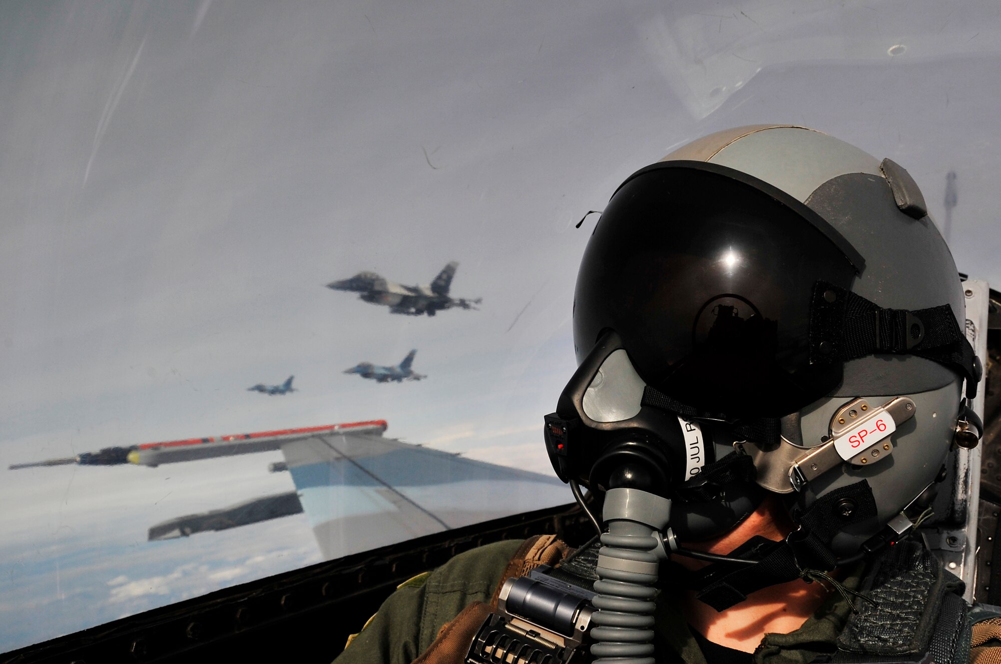 F-16 Aggressors fly over the Joint Pacific Alaskan Range Complex looking for enemy aircraft during Red Flag-Alaska 09-3 July 28, 2009, Eielson Air Force Base. RF-A is a Pacific Air Forces-directed field training exercise poised at giving aircrews their first 10 flights in combat. The F-16 Aggressors are assigned to the 18th Aggressor Squadron. (U.S. Air Force photo/Staff Sgt. Christopher Boitz)