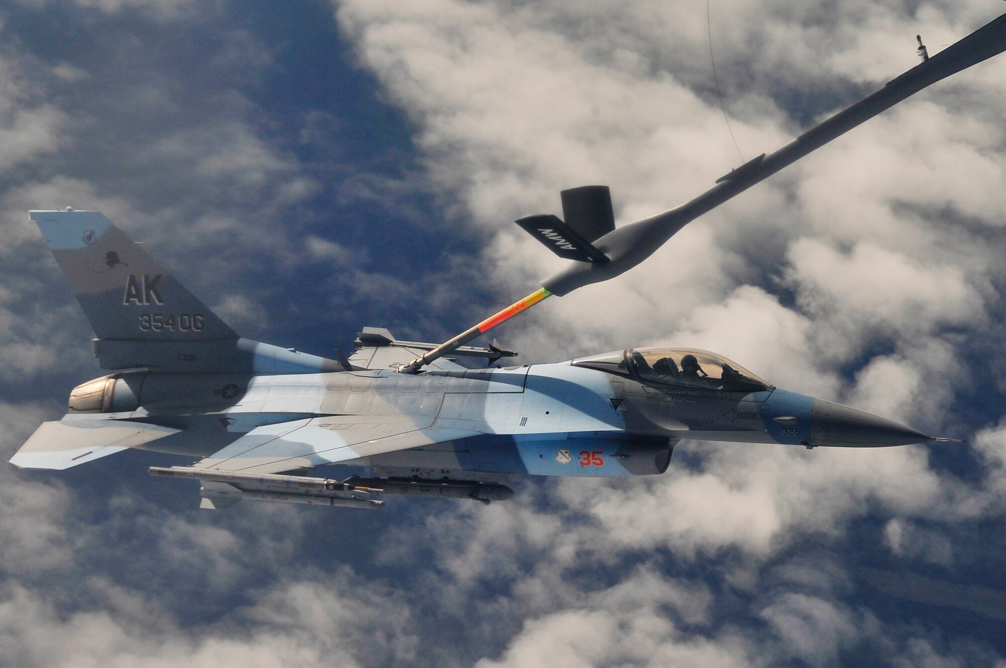 Brig. Gen. Mark W. Graper receives fuel from a KC-135 from MacDill Air Force Base, Florida, over the Joint Pacific Alaskan Range Complex in an F-16 Aggressor during Red Flag-Alaska 09-3 July 28, 2009, Eielson Air Force Base. RF-A is a Pacific Air Forces-directed field training exercise poised at giving aircrews their first 10 flights in combat. General Graper is the 354th Fighter Wing commander. (U.S. Air Force photo/Staff Sgt. Christopher Boitz)