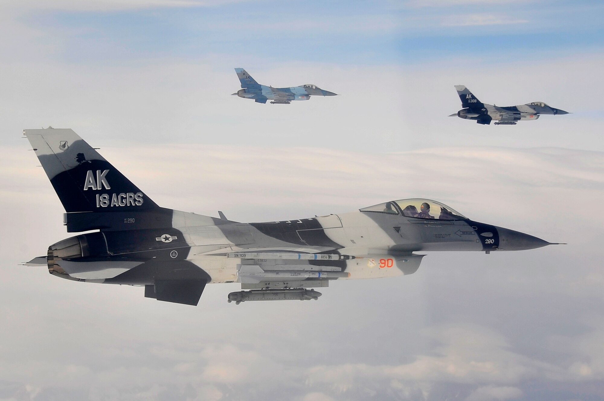 A formation of F-16 Aggressors fly over the Joint Pacific Alaskan Range Complex during Red Flag-Alaska 09-3 July 28, 2009, Eielson Air Force Base. RF-A is a Pacific Air Forces-directed field training exercise for U.S. Forces to fly under simulated air combat conditions. The Aggressors mission is to know, teach, and replicate enemy threats. (U.S. Air Force photo/Staff Sgt. Christopher Boitz)