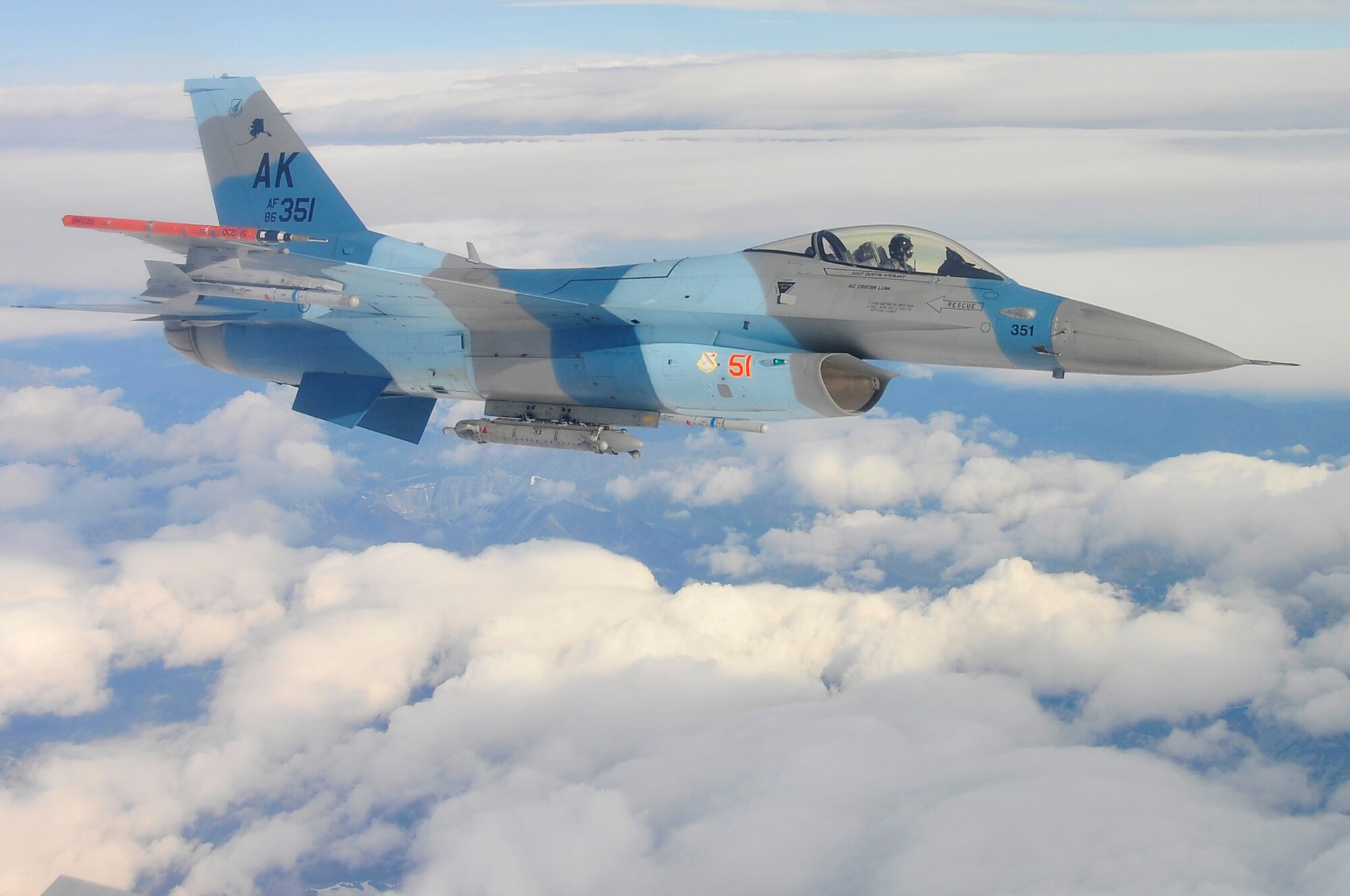 Maj. Jeff Simmons flies over the Joint Pacific Alaskan Range Complex in an F-16 Aggressor during Red Flag-Alaska 09-3 July 28, 2009, Eielson Air Force Base. RF-A is a Pacific Air Forces-directed field training exercise for U.S. Forces to fly under simulated air combat conditions. Major Simmons is a pilot assigned to the 18th Aggressor Squadron. (U.S. Air Force photo/Staff Sgt. Christopher Boitz)