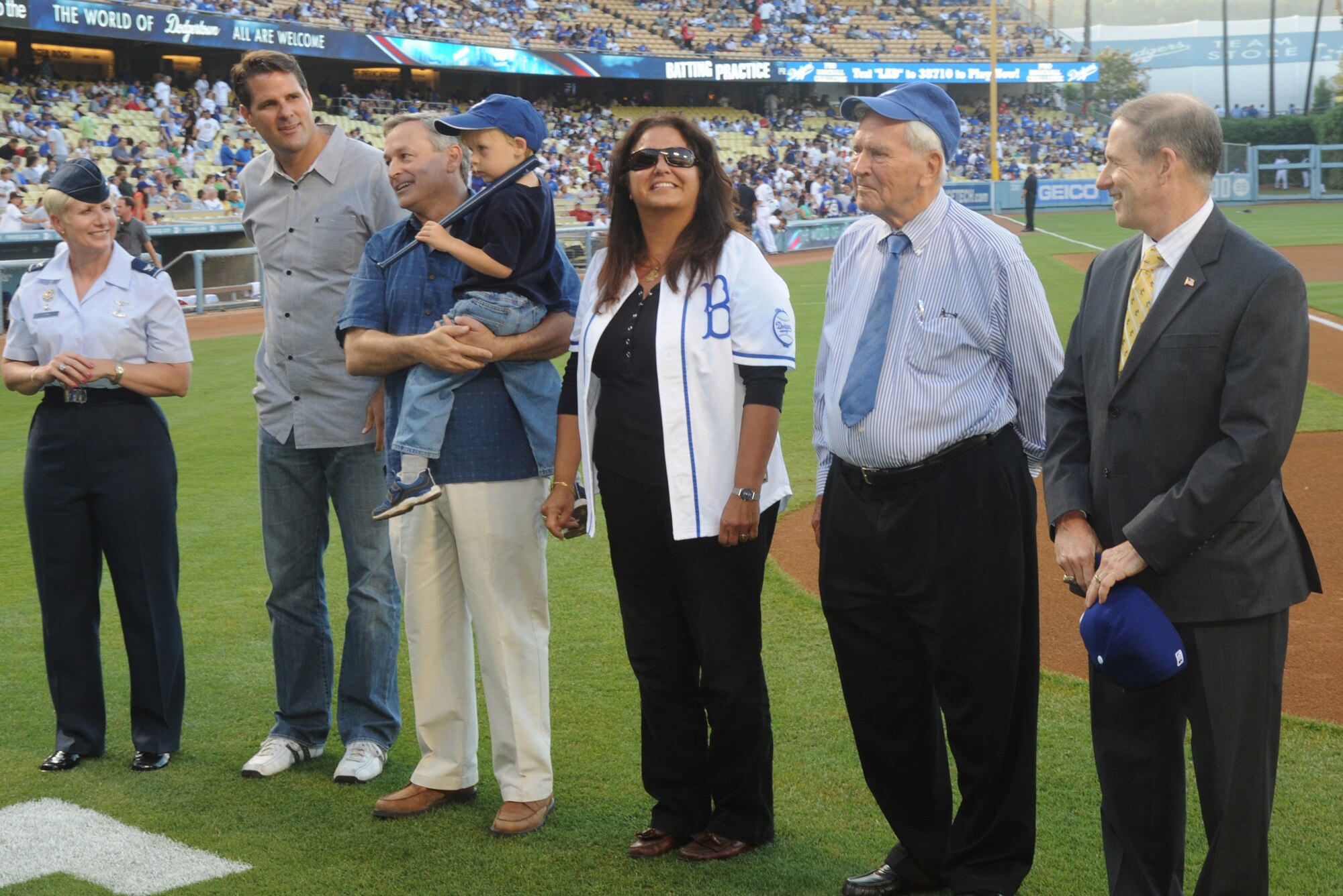 Officials from LAAFB and the City of El Segundo were introduced on the field prior to the game, July 24.  Pictured from left to right are: Col. Anita Latin, 61st Air Base Wing commander; El Segundo Mayor Pro Tem Eric Busch; City Councilman Bill Fisher and his grandson; Lilly Craig; Bill Mason; and  Douglas Loverro, SMC  executive director.  (Photo by Atiba S. Copeland)