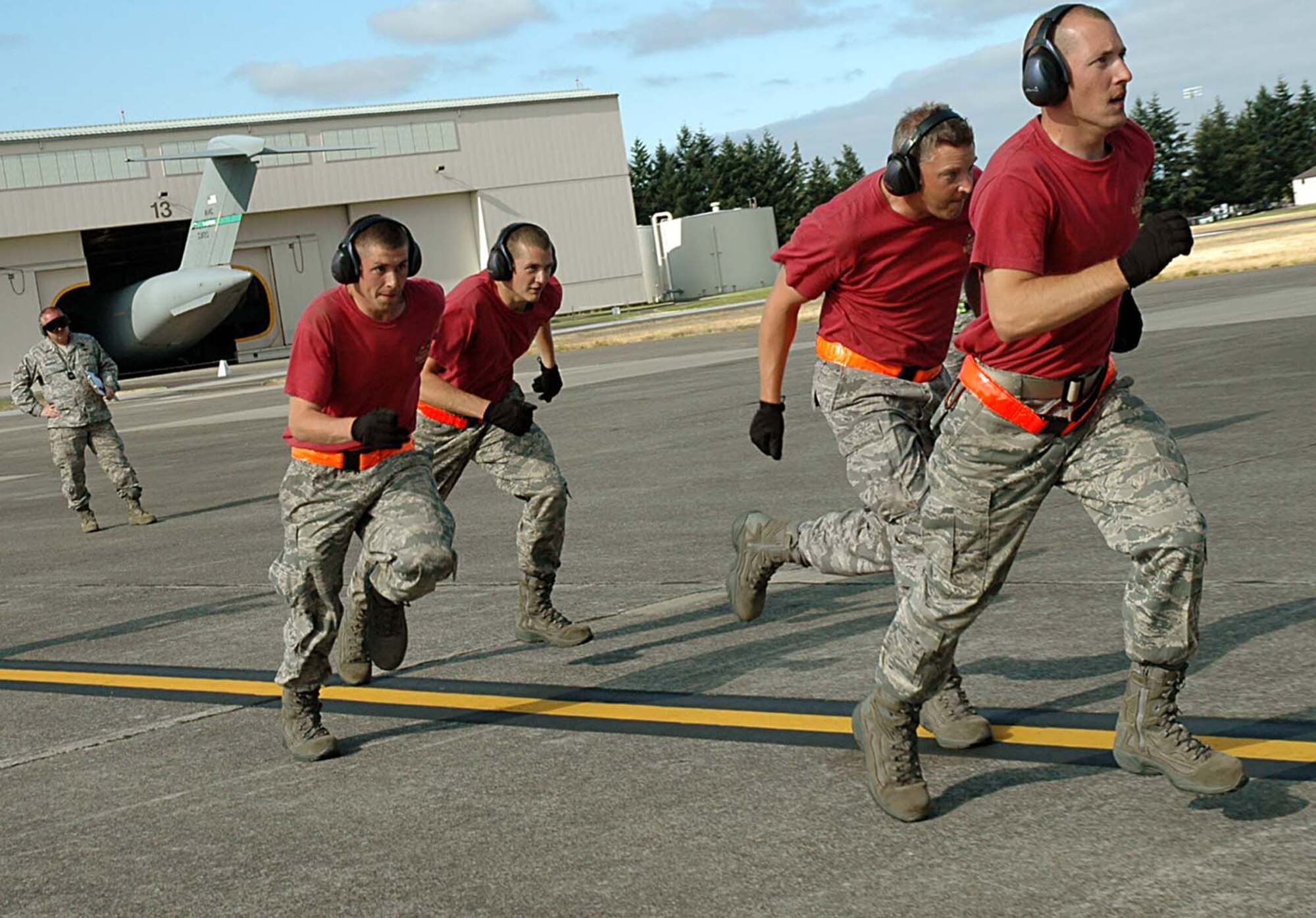 The 446th Airlift Wing Rodeo Aerial Port team is charges the ramp of a C-17 during the second half of the engine running onload/offload event at Rodeo 2009, McChord Air Force Base Wash. (Air Force photo/Airman 1st Class Patrick Cabellon)
