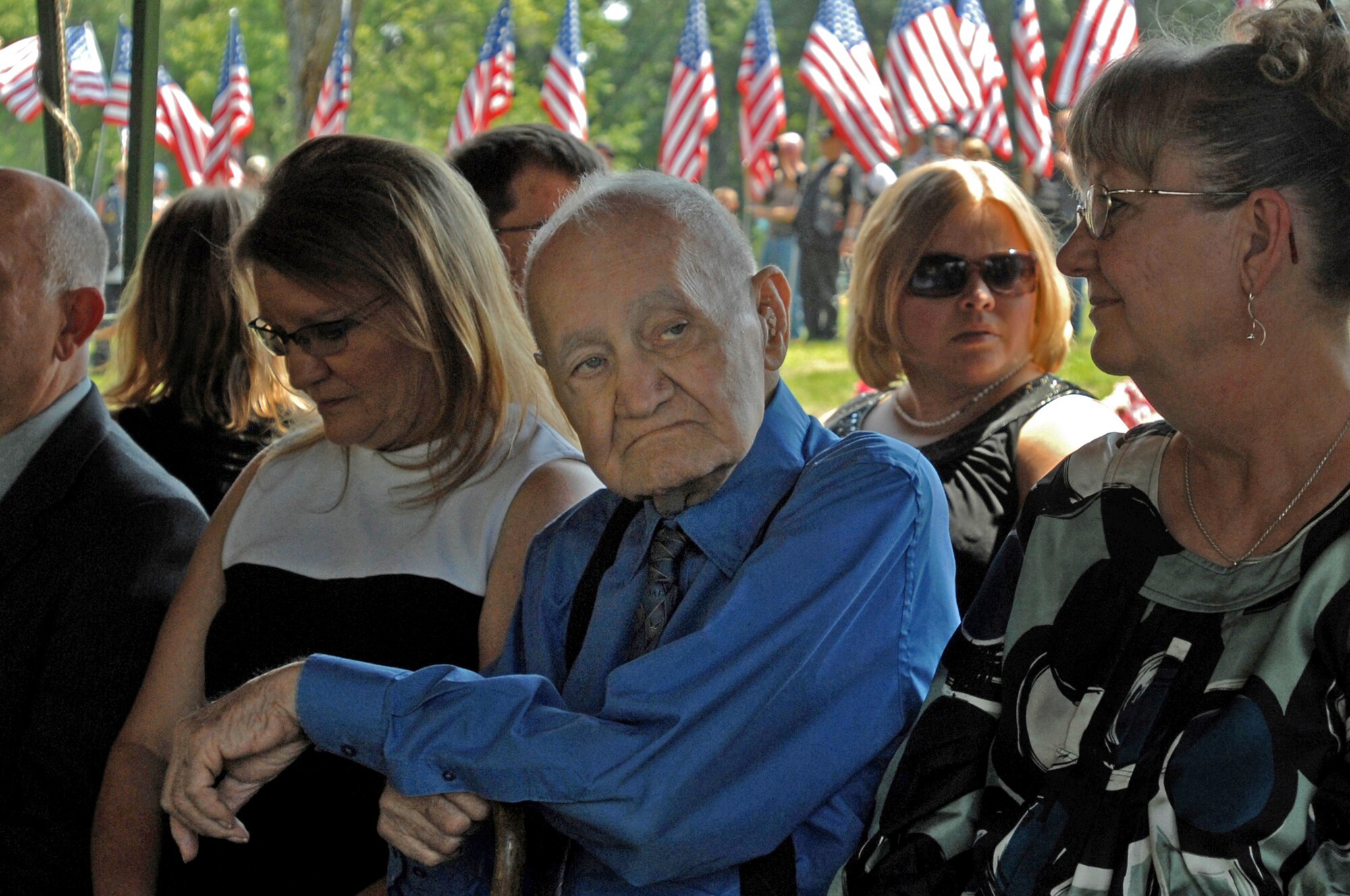 Kenneth Adam, father of Chief Master Sgt. Quincy Adam, waits for the burial portion of his son's funeral service to begin July 27 at Chapel Hill Memorial Cemetery in Kansas City, Kan. Chief Adam is a Vietnam War veteran who was missing in action for more than 40 years. Chief Adam's remains were discovered in Southeast Asia, and he was finally brought home to be laid to rest, giving his family closure in their lives. (U.S. Air Force photo/Senior Airman Kenny Holston)