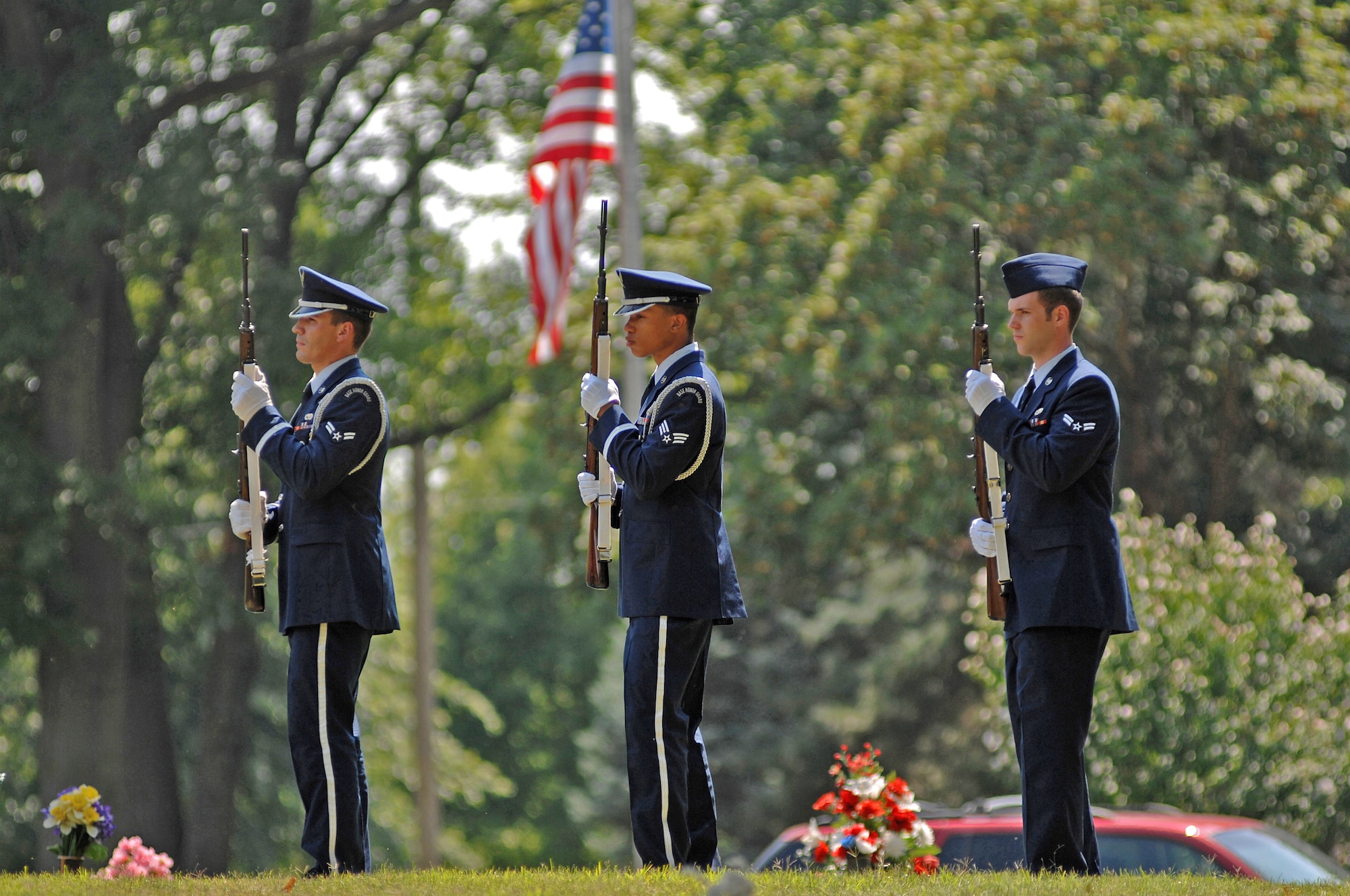 Airmen with the Whiteman Air Force Base Honor guard render a 21-gun salute July 27 to honor Chief Master Sgt. Quincy Adam at Chapel Hill Memorial Cemetery. Chief Adam is a Vietnam War veteran who was missing in action for more than 40 years. Chief Adam's remains were discovered in Southeast Asia and he was finally brought home to be laid to rest, giving his family closure in their lives. (U.S. Air Force photo/Senior Airman Kenny Holston)