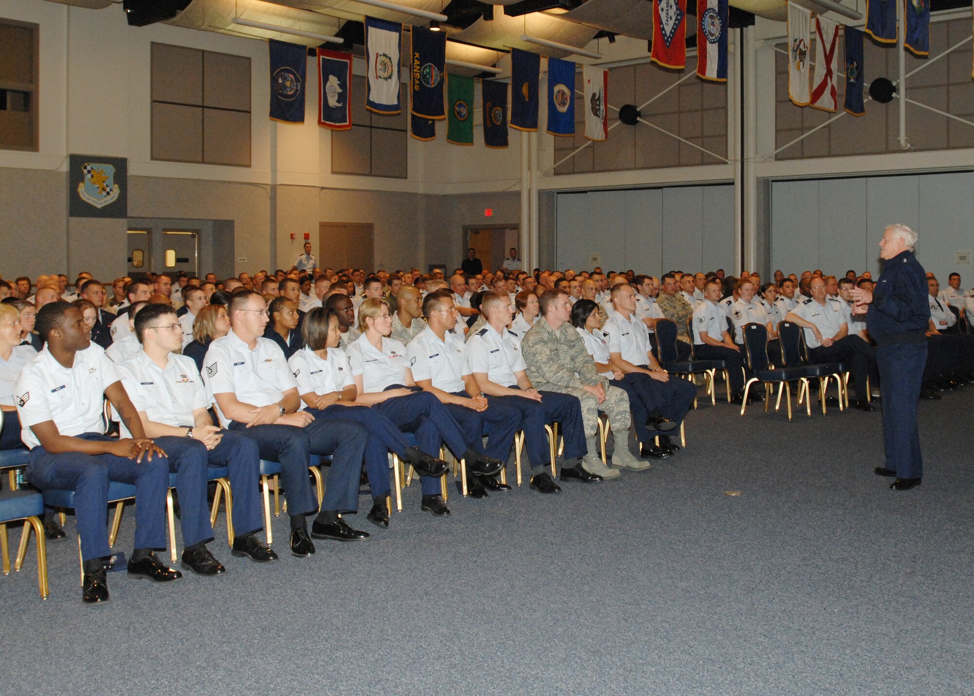 MCCONNELL AIR FORCE BASE, Kan. -- Gen. Arthur Lichte, Air Mobility Command commander, briefs Team McConnell members on his leadership philosophy at the Robert J. Dole Community Center July 27. General Lichte compared his ideas of leadership to the New York Yankees, and how they dealt with their daily issues as a baseball team. (Photo by Staff Sgt. Jamie Train)