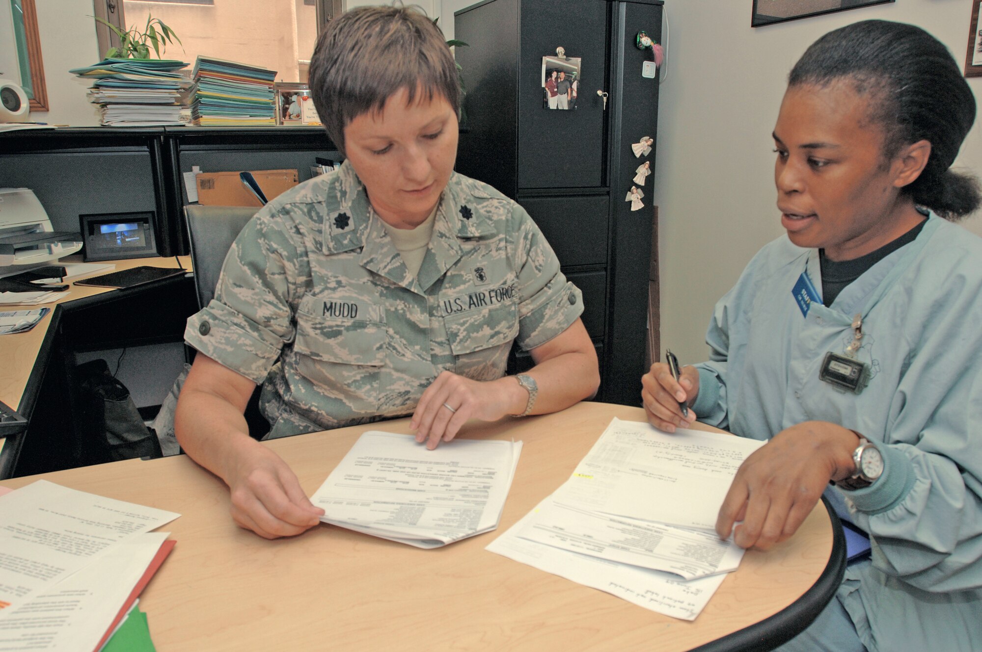 Lt. Col. Jacqueline Mudd (left) looks over flash sterilization data with Capt. Yvonne Storey July 22 at Lackland Air Force Base, Texas. Colonel Mudd was chosen the 2009 recipient of the Gen. Benjamin O. Davis Jr., Military Award by the Tuskegee Airmen Incorporated. Colonel Mudd is the operating room flight commander for the 59th Surgical Operations Squadron, and Captain Storey is an operating room nurse in the 59th SOS. (U.S. Air Force photo/Senior Airman Nicole Roberts)
