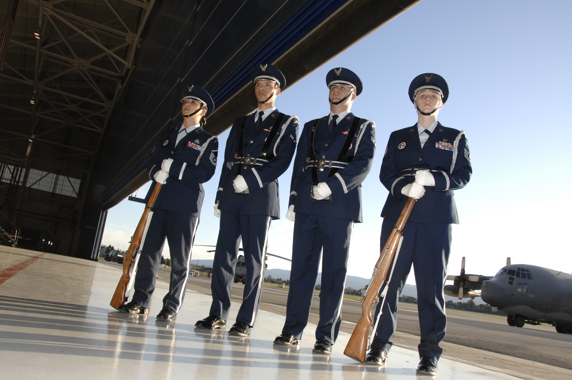 Base honor guard members from the 129th Rescue Wing, Moffett Federal Airfield, Calif., perform at a retirement ceremony at Moffett Field Feb. 7, 2009. (Air National Guard photo by Master Sgt. Dan Kacir)(RELEASED)