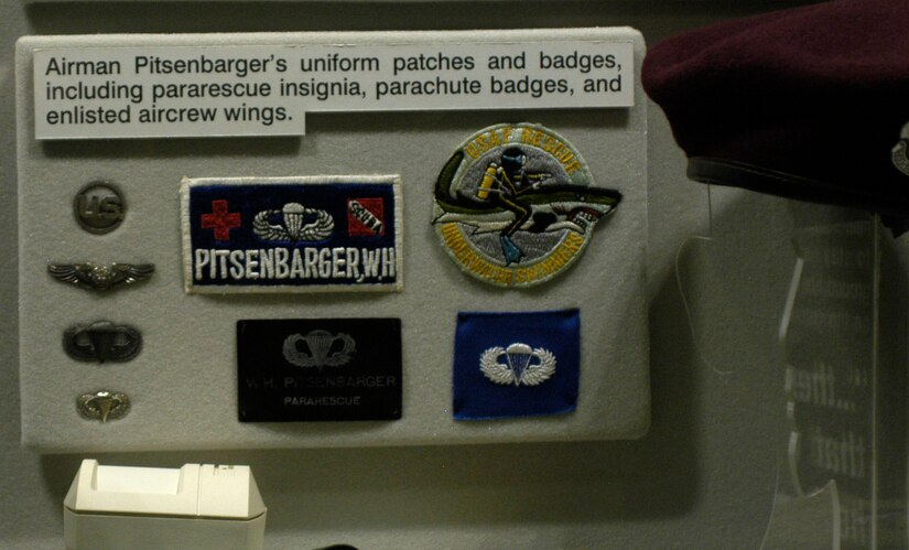 DAYTON, Ohio - Pitsenbarger's uniform patches and badges, including pararescue insignia, parachute badges, and enlisted aircrew wings. (U.S. Air Force photo)