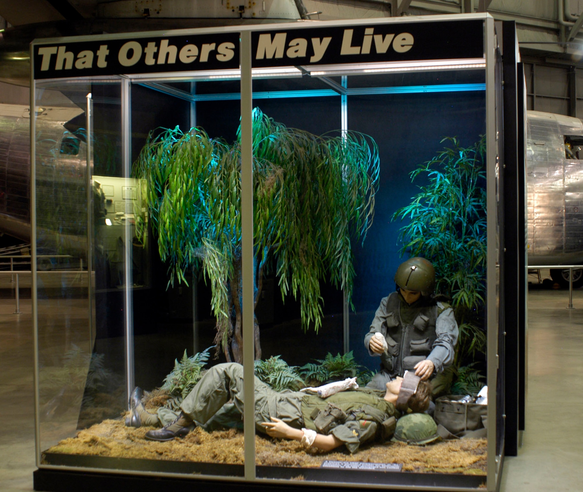 DAYTON, Ohio - A Vietnam-era USAF pararescuman, or "PJ," prepares a wounded soldier for helicopter evacuation in a diorama in the Southeast Asia War Gallery. PJs often descended into combat situations to aid the wounded. (U.S. Air Force photo)