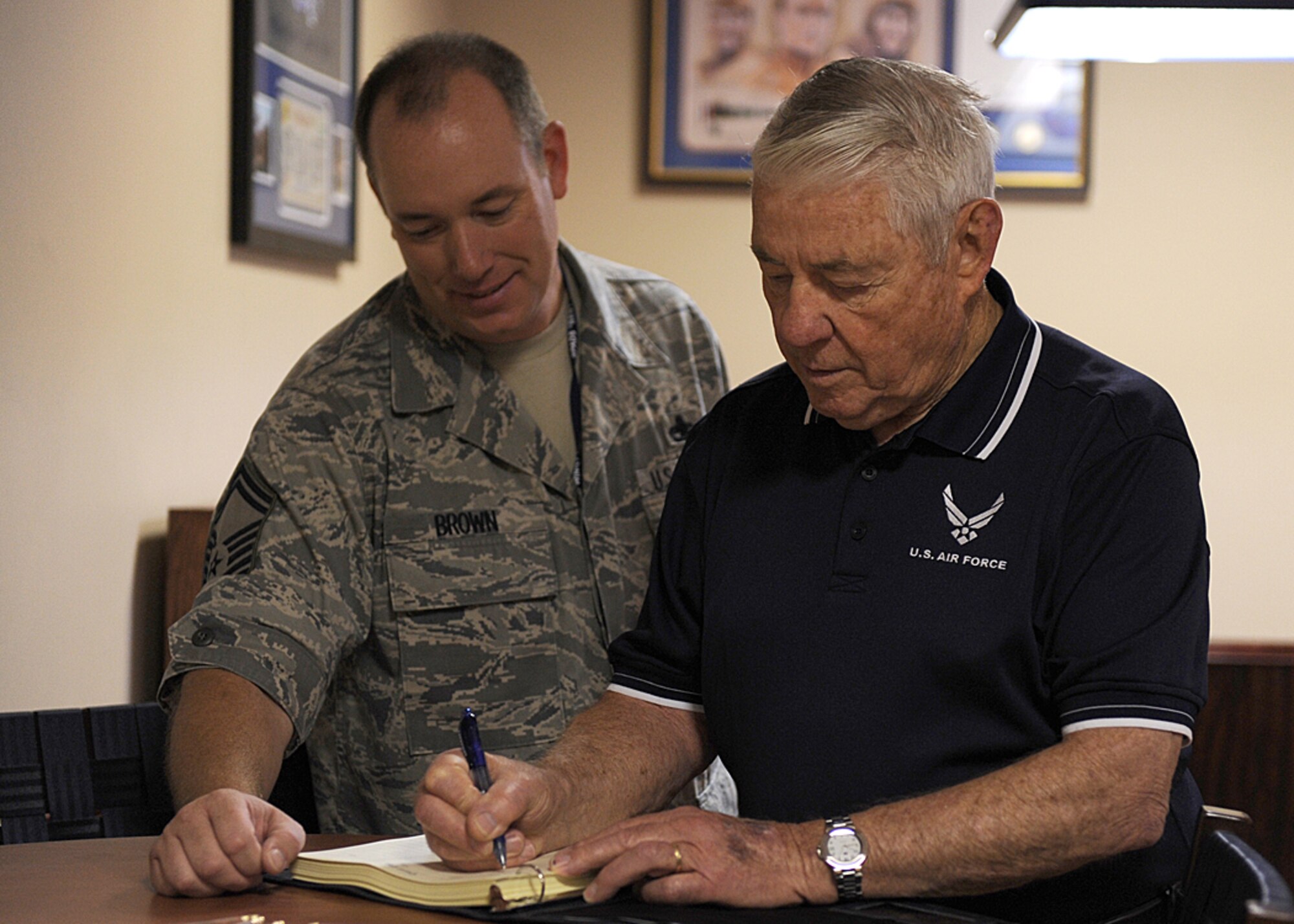 LANGLEY AIR FORCE BASE, Va. -- Bob Gaylor, fifth Chief Master Sgt. of the Air Force, signs the Chiefs log book at the 71st Fighter Squadron here July 23. Chief Gaylor is touring Langley, and speaking to Airmen about the Air Force and how to keep your self motivated. (U.S. Air Force photo/Airman 1st Class Jonathan Koob)
