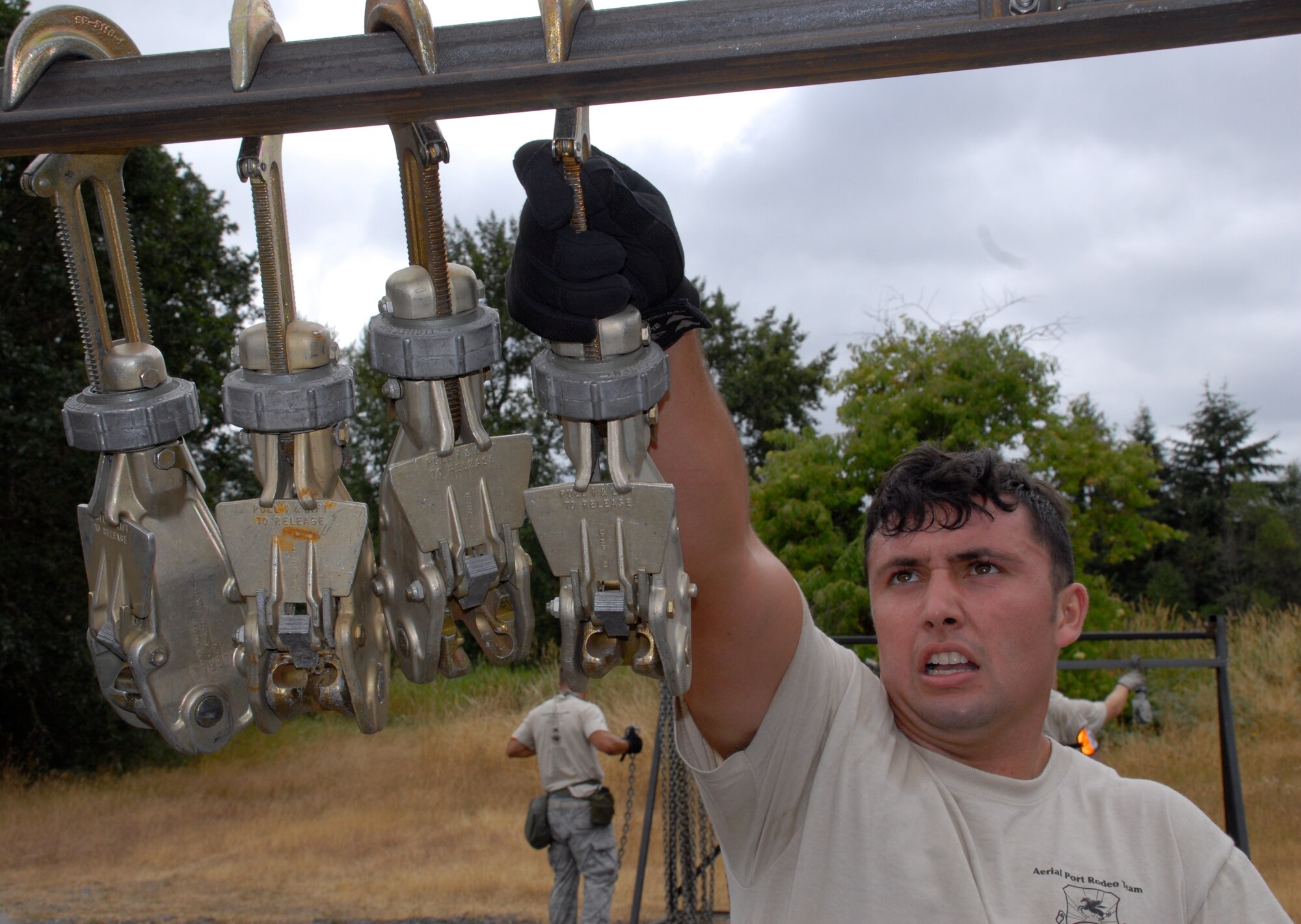 MCCHORD AIR FORCE BASE, Wash. – The 515th Air Mobility Operations Wing Air Mobility Rodeo 2009 Pacific aerial porter Staff Sgt. Dustin Barboza, 734th Air Mobility Squadron, Andersen Air Base, Guam, hangs a hook and chain during the Aerial Porters Combat Challenge here July 23. During the challenge, aerial porters had to sprint along a four-mile course, stopping to overcome physical and mental obstacles. They finished the entire course in 57 minutes and 26 seconds. The 515th AMOW team is an eight-person group of Airmen who were hand-picked from more than 500 other aerial porters in the Pacific to compete in the Rodeo 2009 competition July 19 to 25 here. Prior to the Rodeo, they trained together at Hickam Air Force Base, Hawaii, for seven weeks. (U.S. Air Force photo/Staff Sgt. Carolyn Viss)