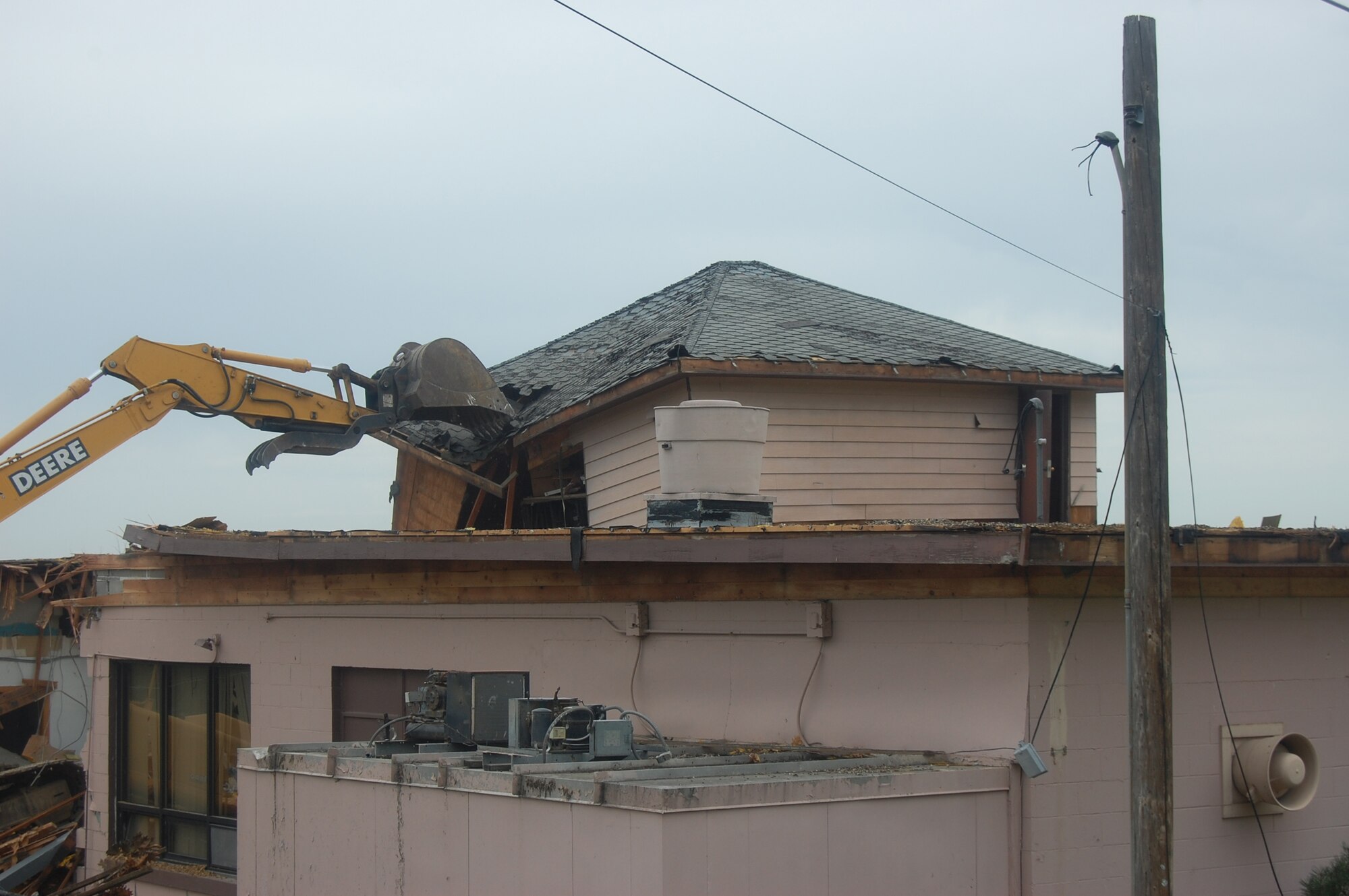 OFFUTT AIR FORCE BASE, Neb. -- Building 418 is demolished here July 27. The facility served numerous purposes including as an Airman's club, community center and military clothing sales store. U.S. Air Force Photo by Staff Sgt. James M. Hodgman