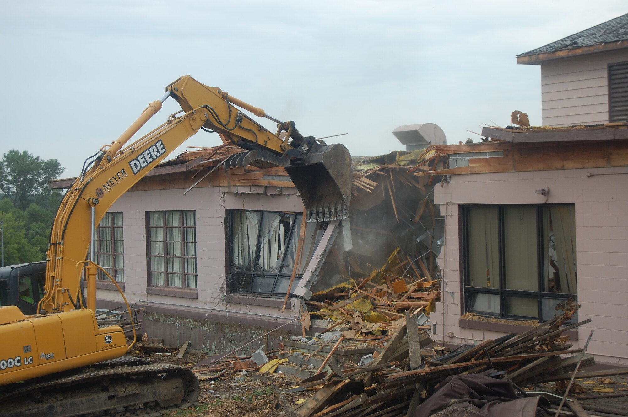 OFFUTT AIR FORCE BASE, Neb. -- Building 418 is demolished here July 27. The facility served numerous purposes including as an Airman's club, community center and military clothing sales store. U.S. Air Force Photo by Staff Sgt. James M. Hodgman