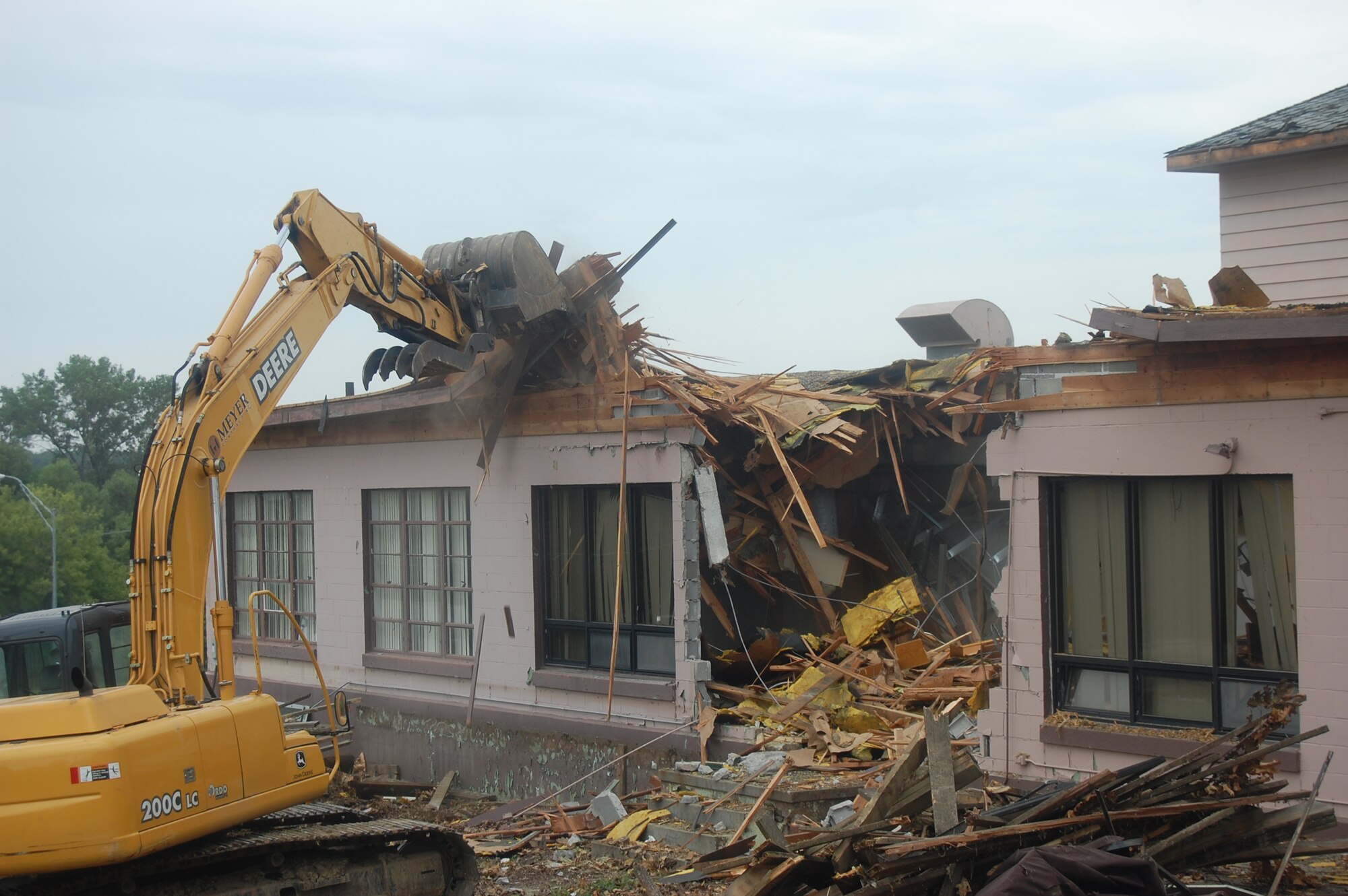 OFFUTT AIR FORCE BASE, Neb. -- Building 418 is demolished here July 27. The facility served numerous purposes including as an Airman's club, community center and military clothing sales store. U.S. Air Force Photo by Staff Sgt. James M. Hodgman