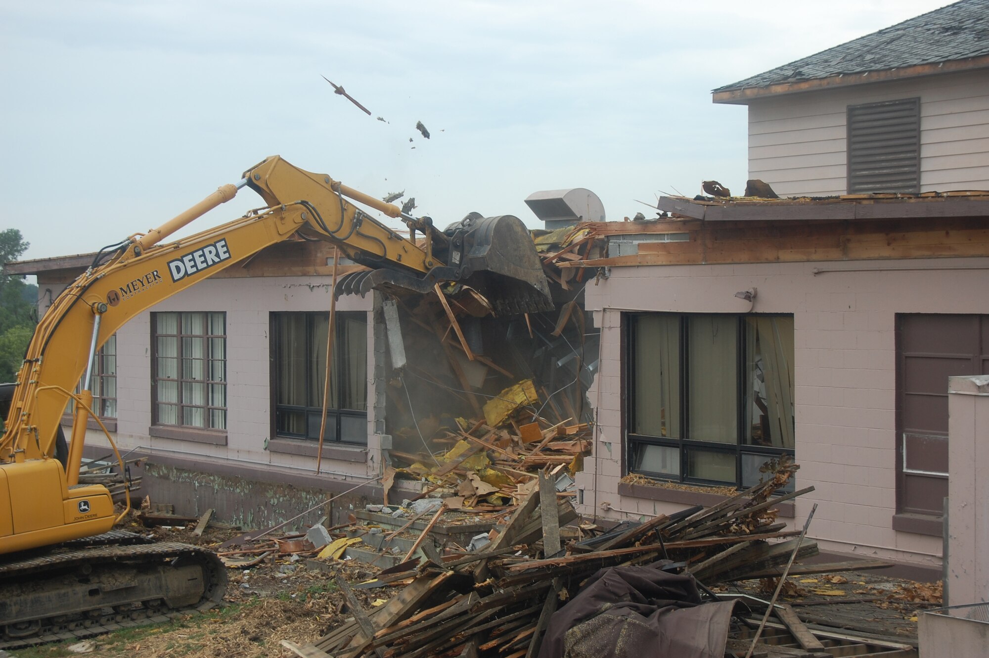 OFFUTT AIR FORCE BASE, Neb. -- Building 418 is demolished here July 27. The facility served numerous purposes including as an Airman's club, community center and military clothing sales store. U.S. Air Force Photo by Staff Sgt. James M. Hodgman
