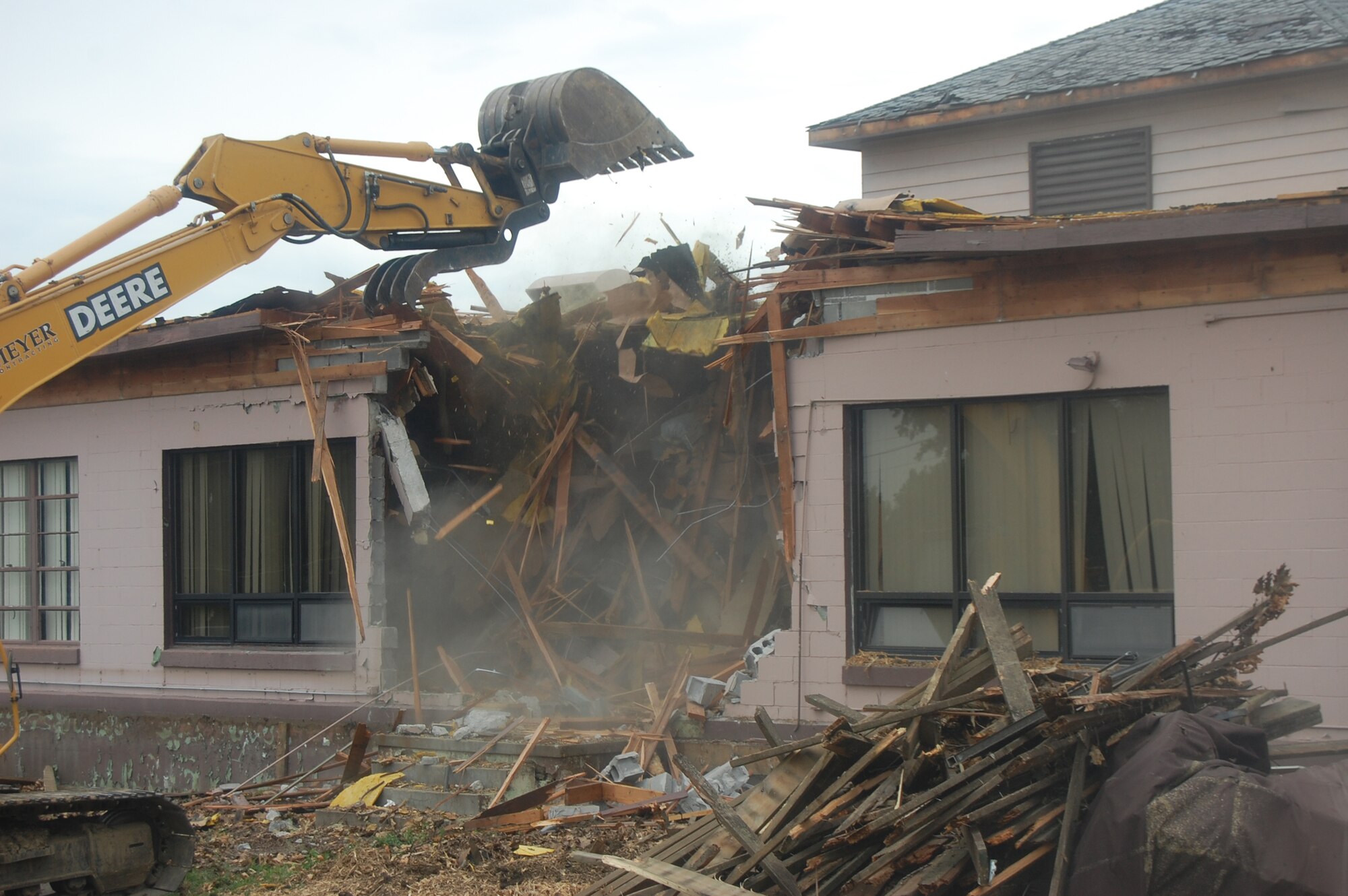 OFFUTT AIR FORCE BASE, Neb. -- Building 418 is demolished here July 27. The facility served numerous purposes including as an Airman's club, community center and military clothing sales store. U.S. Air Force Photo by Staff Sgt. James M. Hodgman